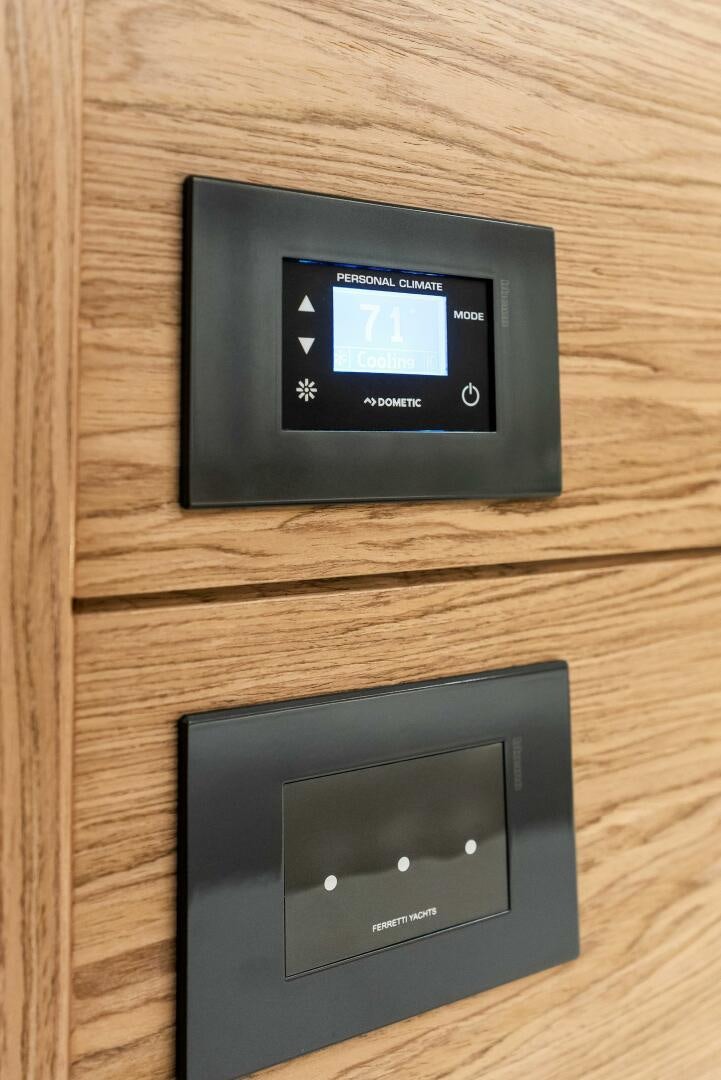 a black electronic device on a wooden surface aboard SILHOUETTE Yacht for Sale