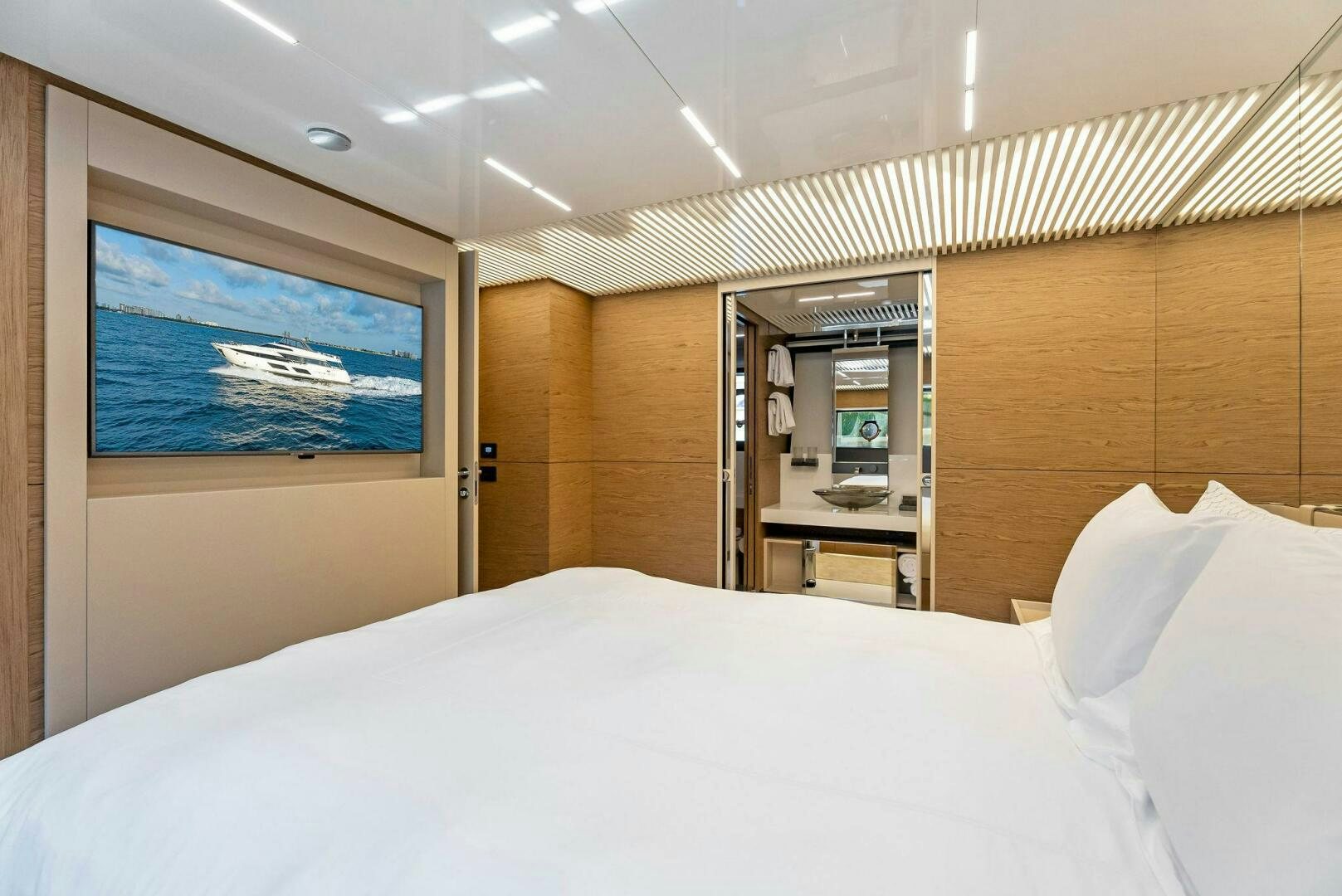 a bed with a white sheet aboard SILHOUETTE Yacht for Sale