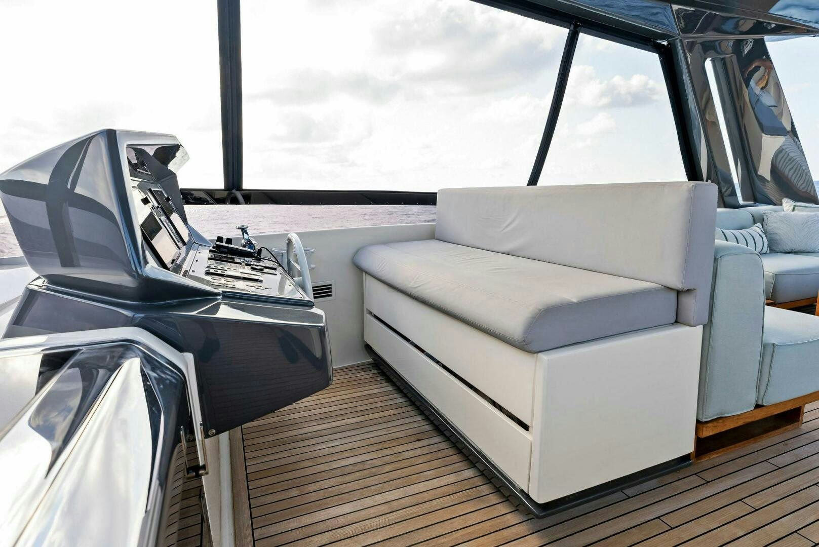 a white couch in a car aboard SILHOUETTE Yacht for Sale