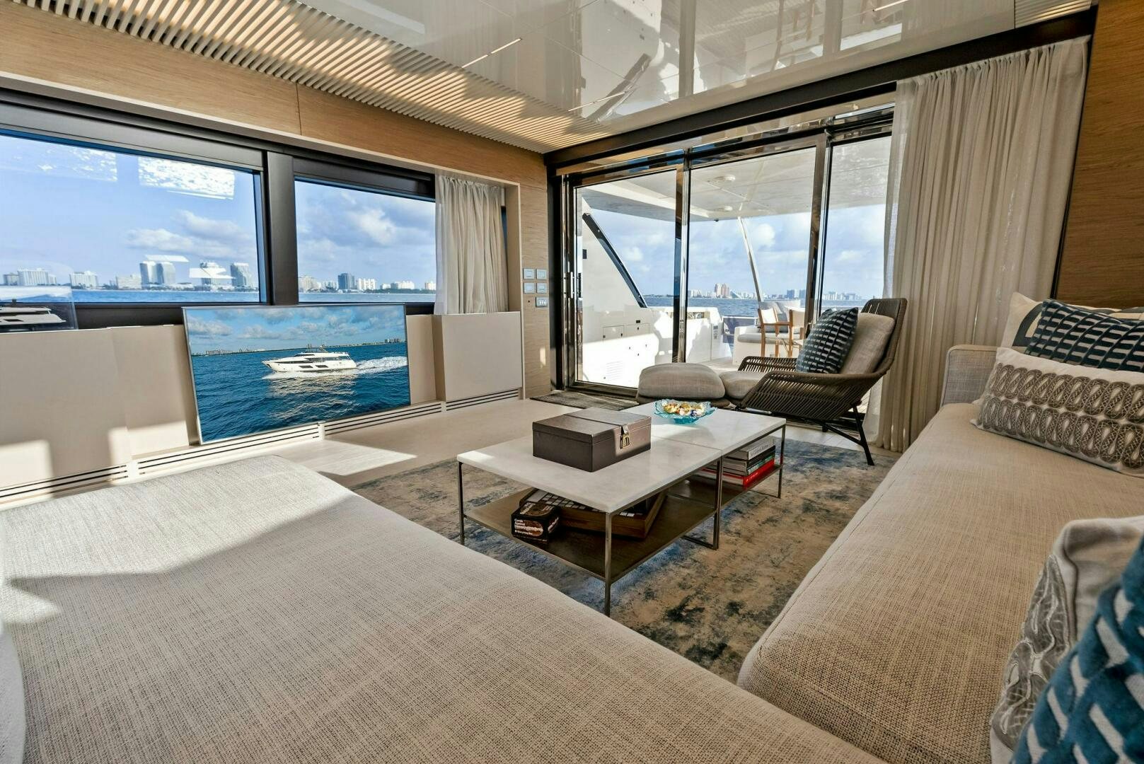 a living room with a large window aboard SILHOUETTE Yacht for Sale