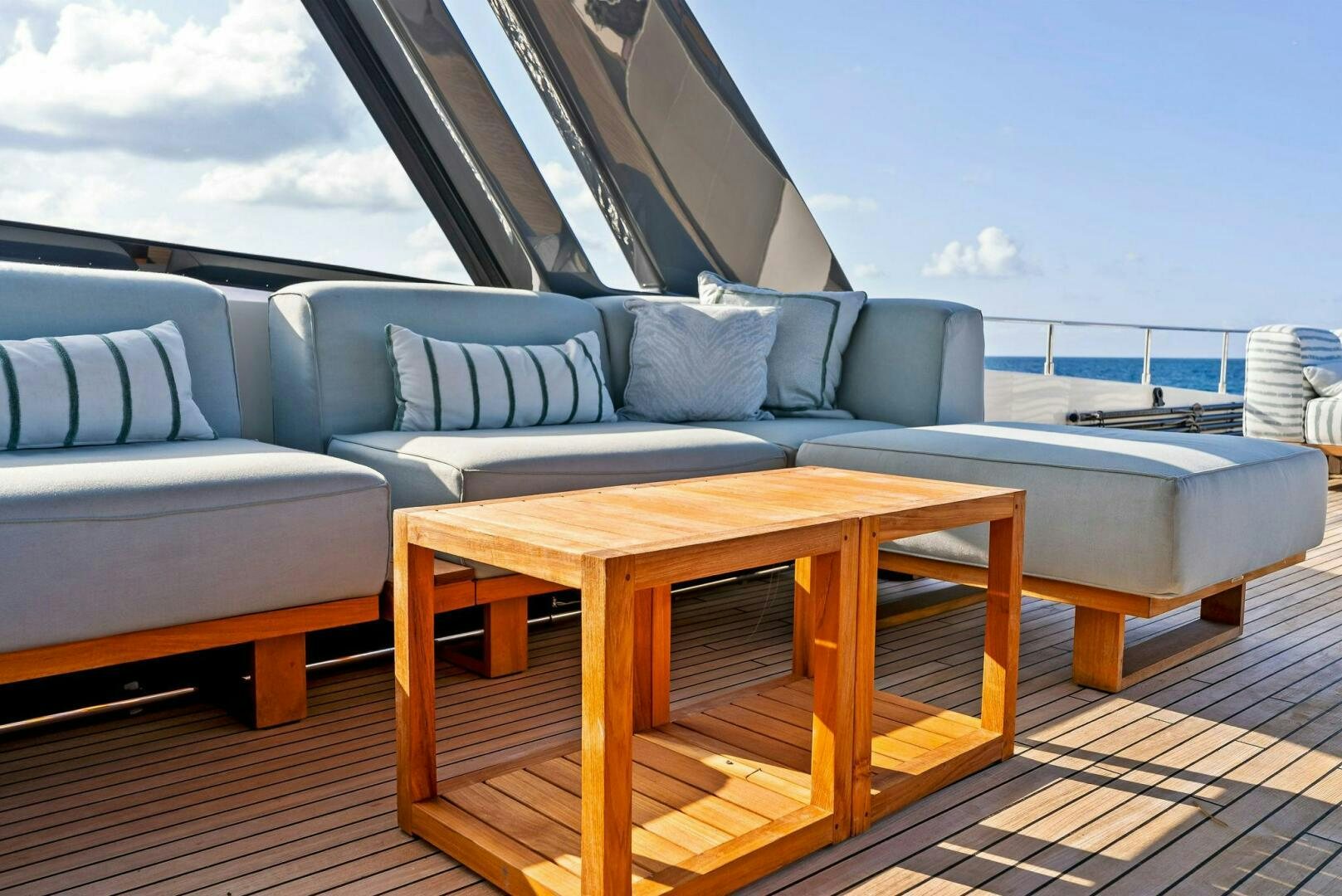 a table and a couch on a deck aboard SILHOUETTE Yacht for Sale