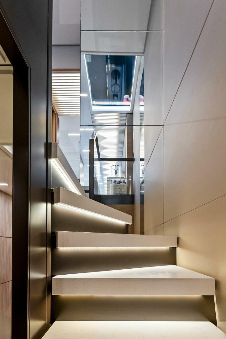 a flight of stairs leading to a window aboard SILHOUETTE Yacht for Sale