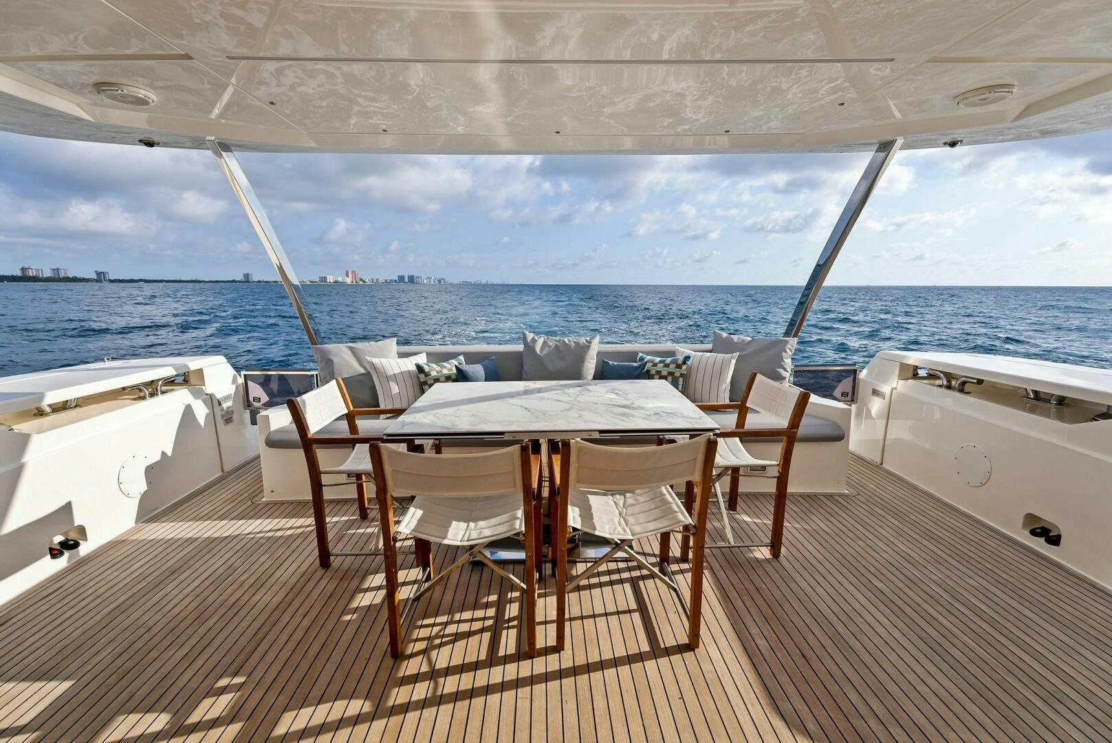 a table and chairs on a deck aboard SILHOUETTE Yacht for Sale