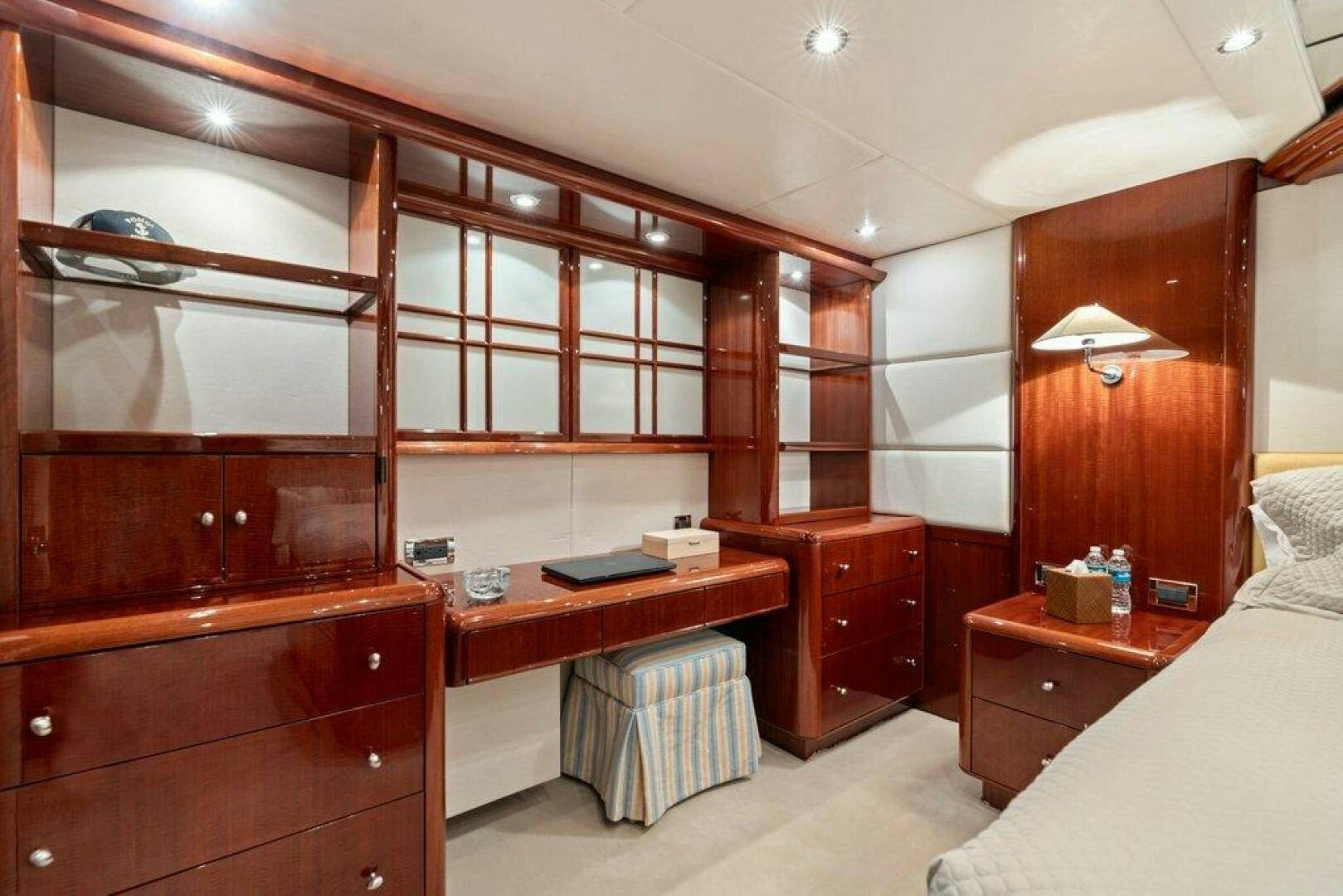 a room with wooden cabinets aboard FOMO2 Yacht for Sale