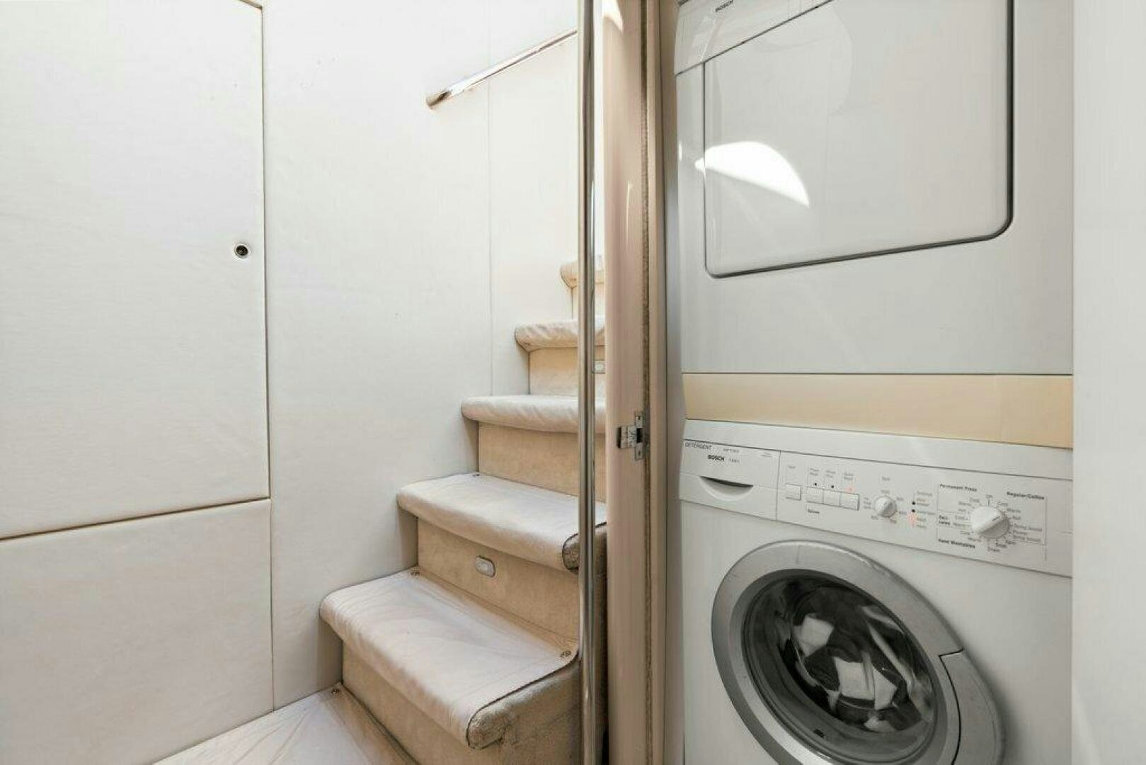 a washer and dryer in a room aboard FOMO2 Yacht for Sale