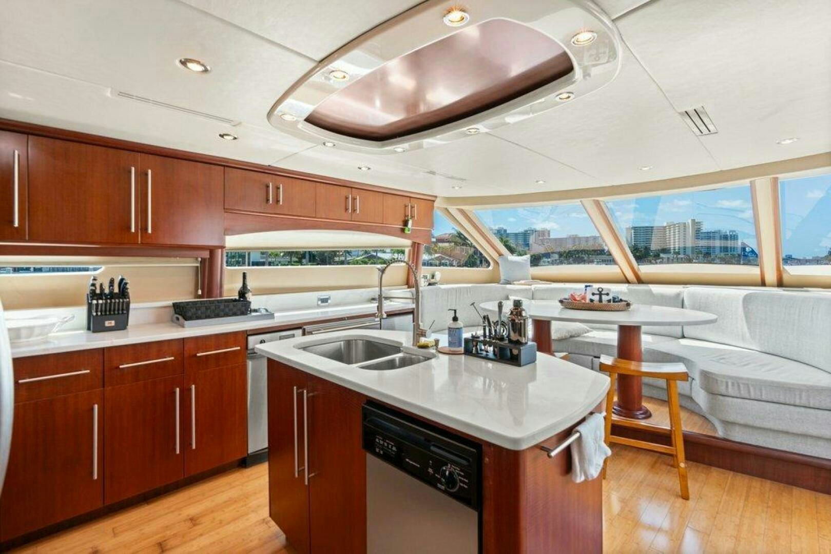 a kitchen with wooden cabinets aboard FOMO2 Yacht for Sale