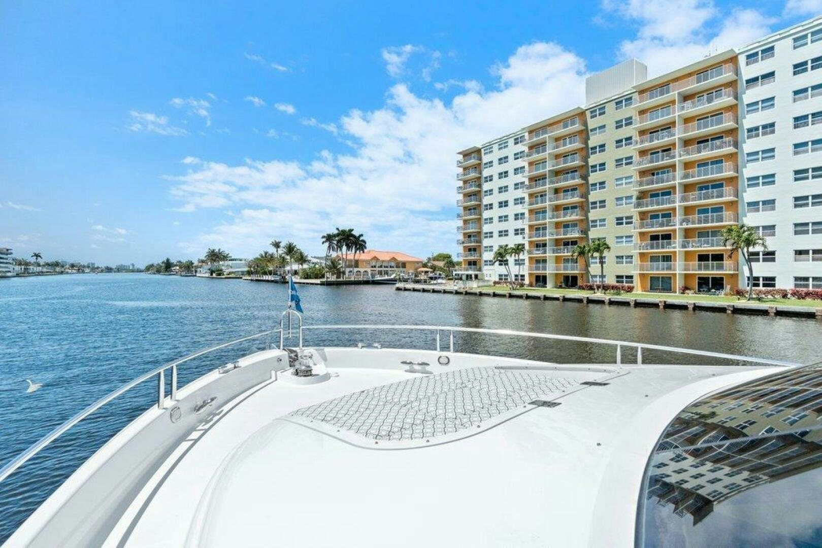 a large building next to a body of water aboard FOMO2 Yacht for Sale