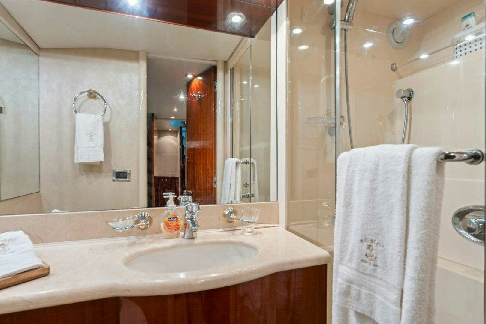 a bathroom with a large mirror aboard FOMO2 Yacht for Sale