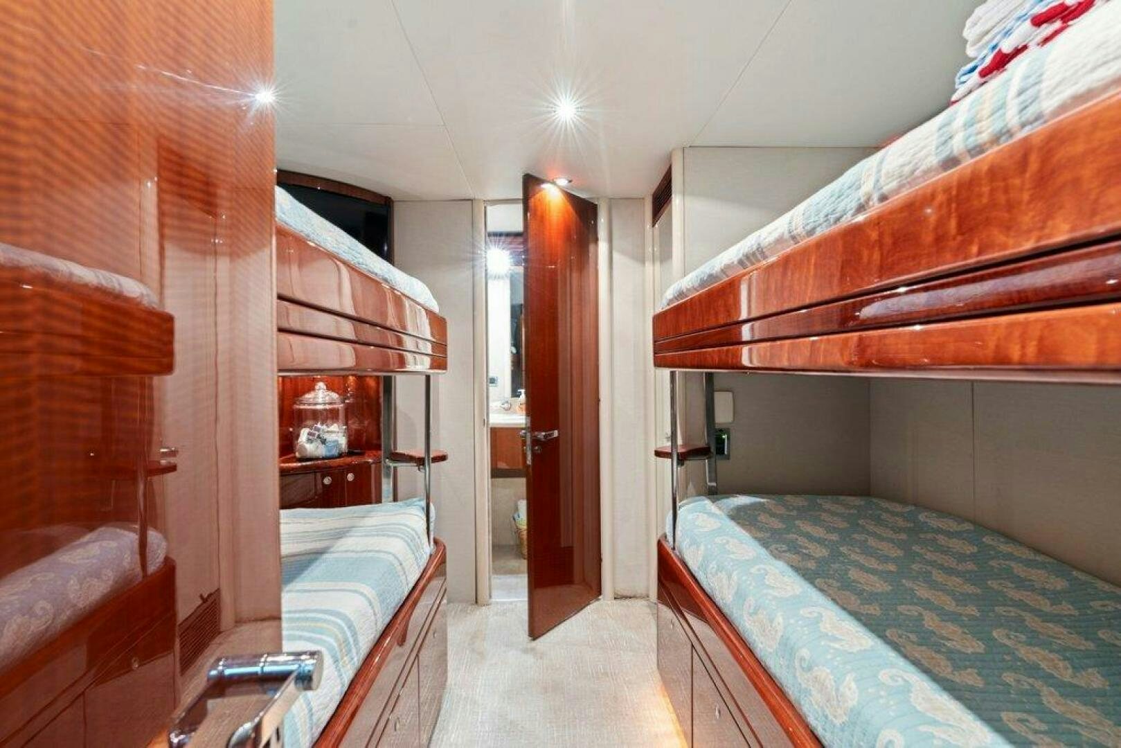 a bedroom with a bed and a closet aboard FOMO2 Yacht for Sale