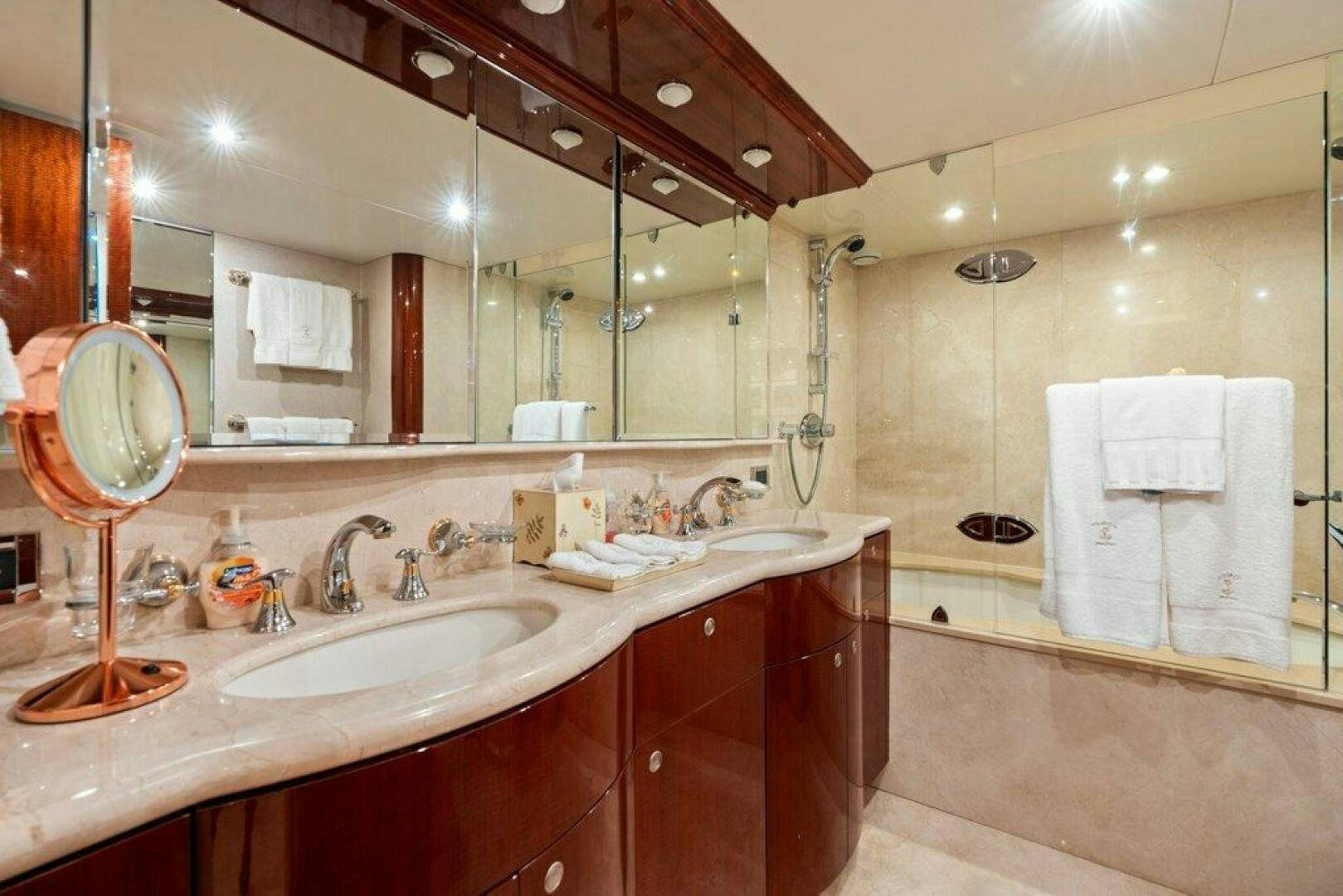 a bathroom with a large mirror aboard FOMO2 Yacht for Sale
