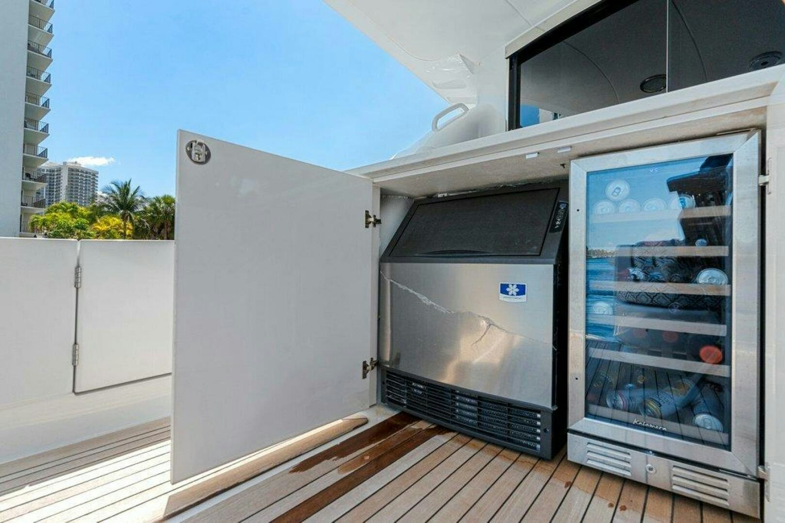 a couple of refrigerators in a room aboard FOMO2 Yacht for Sale