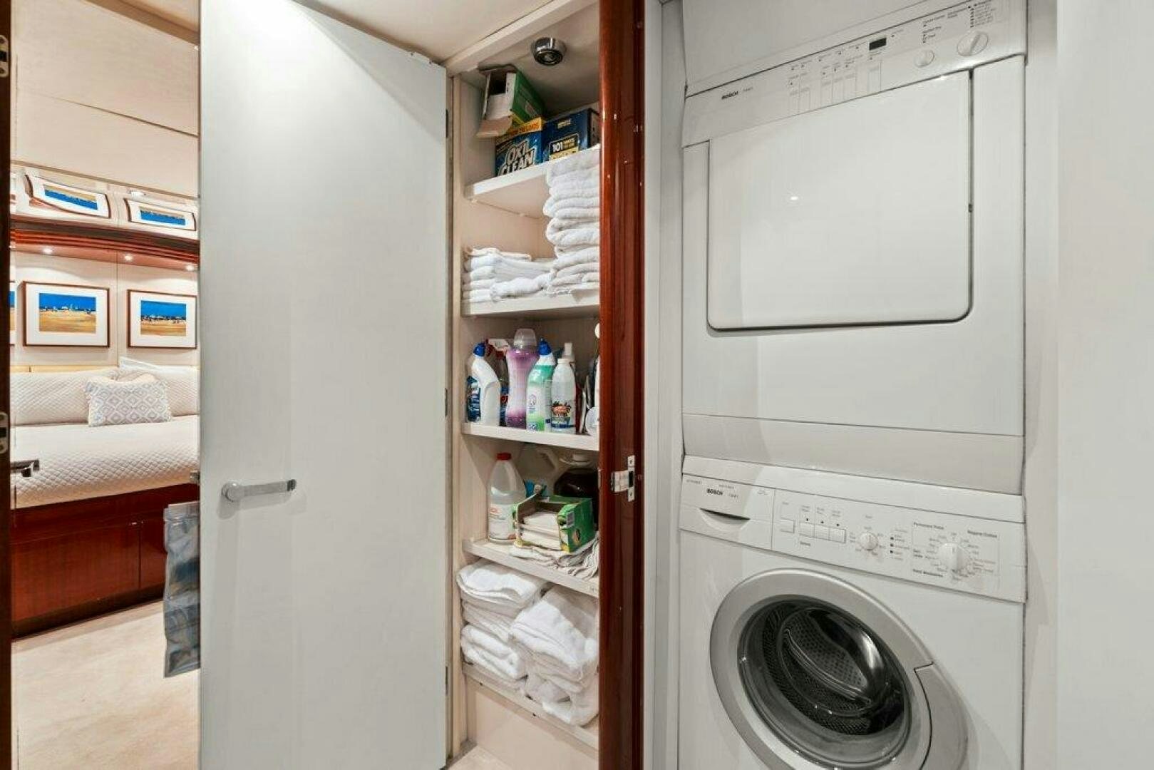a white refrigerator with a door open aboard FOMO2 Yacht for Sale