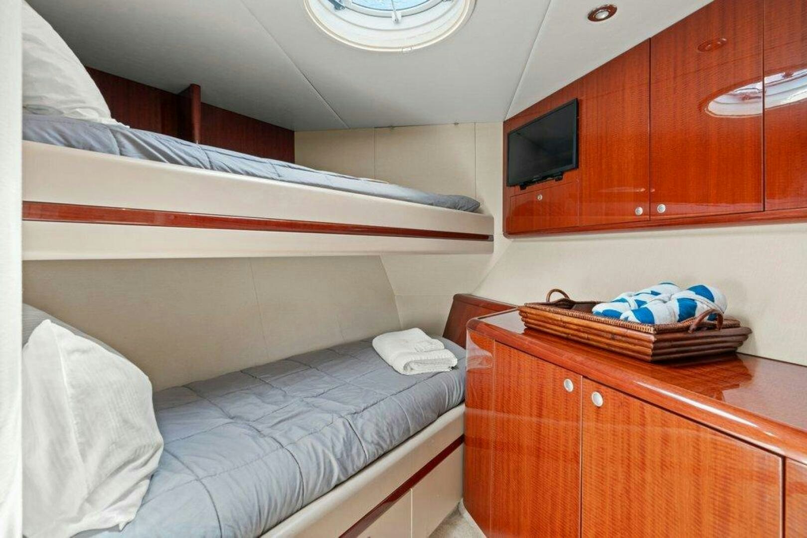 a room with bunk beds aboard FOMO2 Yacht for Sale