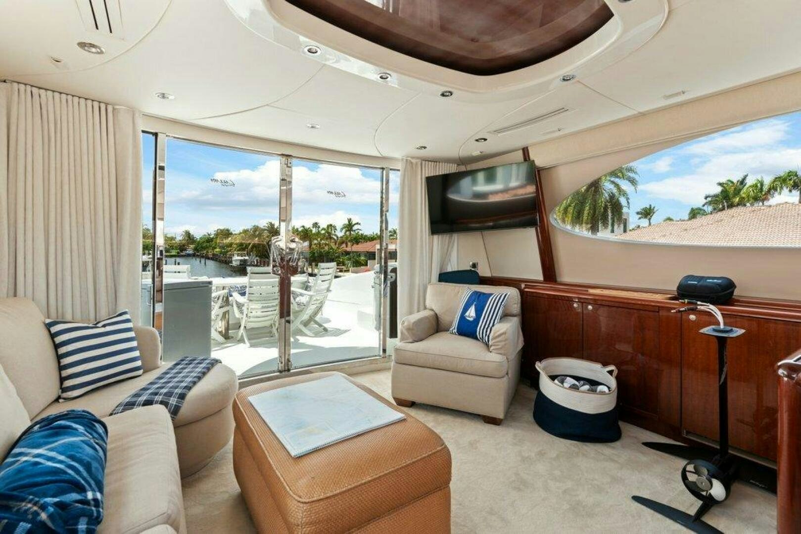 a living room with a view of the ocean aboard FOMO2 Yacht for Sale