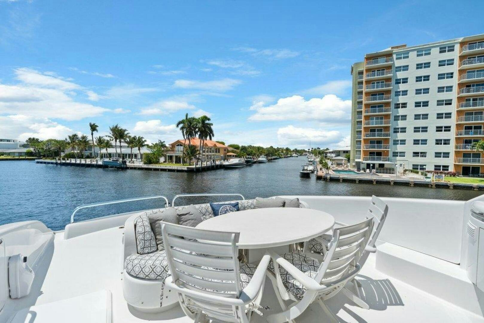 a white lounge chair on a boat aboard FOMO2 Yacht for Sale