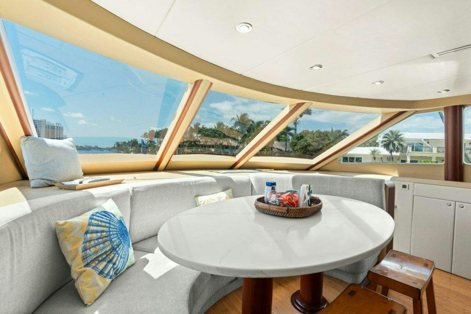 a table with a bowl of fruit on it aboard FOMO2 Yacht for Sale
