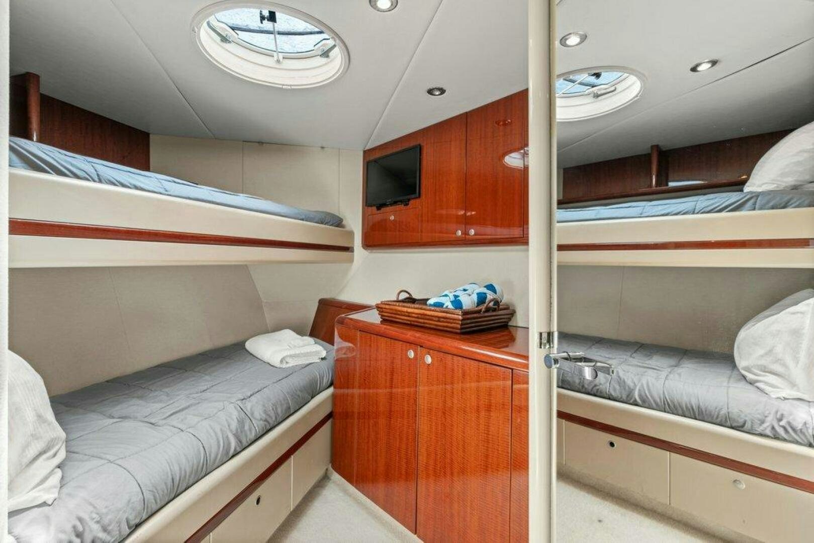 a room with bunk beds aboard FOMO2 Yacht for Sale