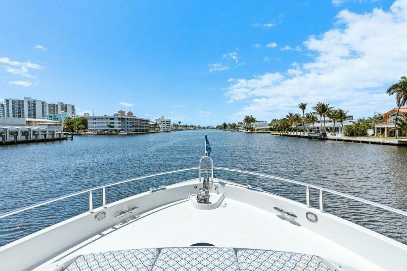 a large white boat on a body of water aboard FOMO2 Yacht for Sale