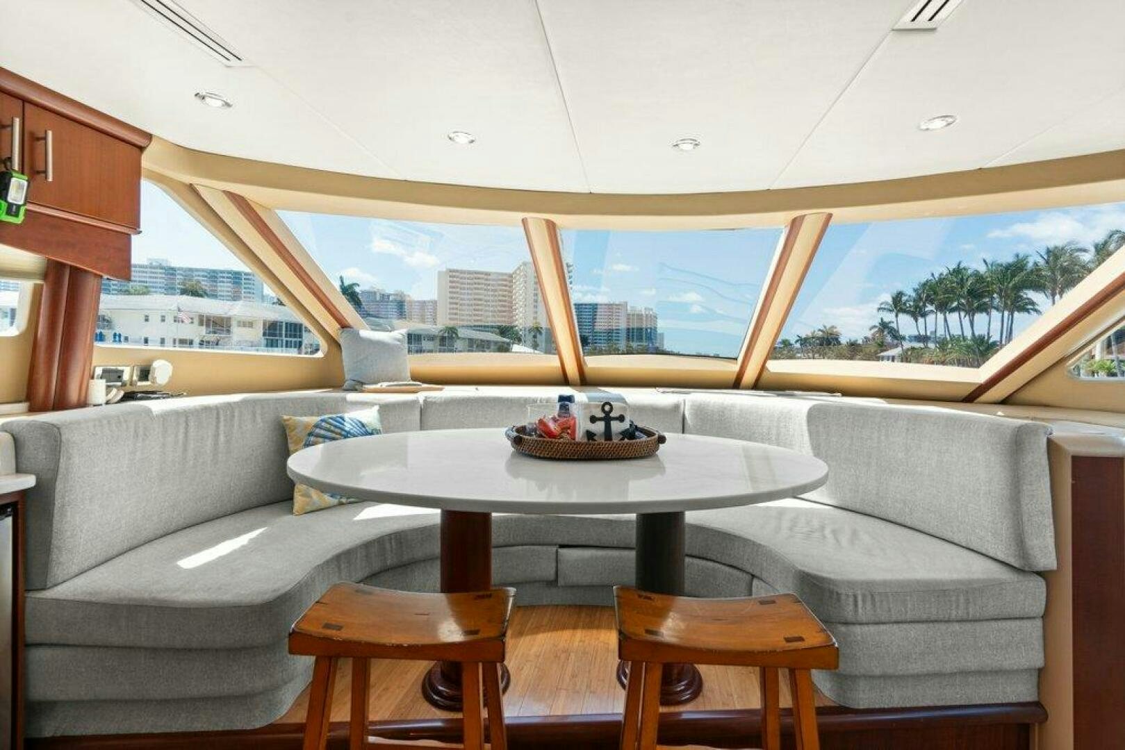 a table and chairs in a room aboard FOMO2 Yacht for Sale