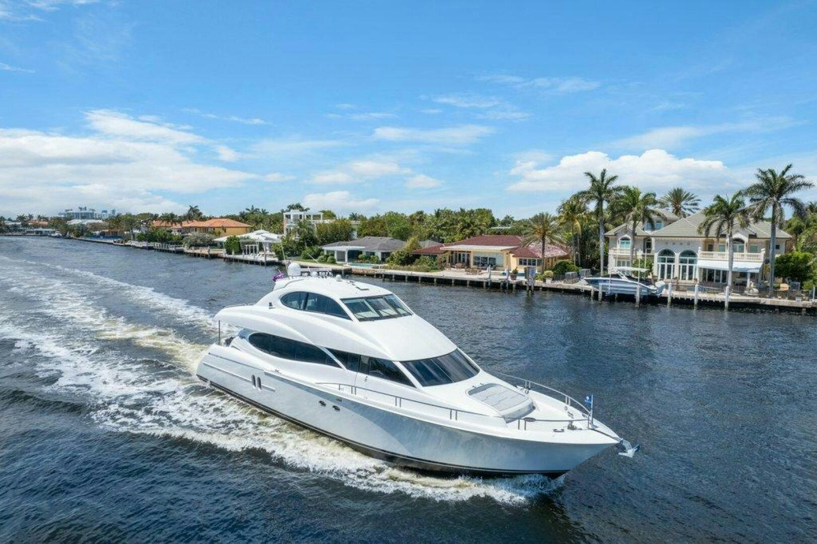 a white boat on the water aboard FOMO2 Yacht for Sale