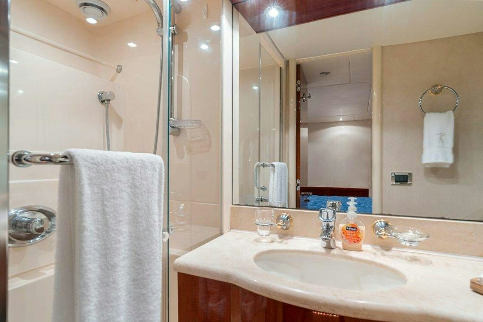 a bathroom with a large mirror aboard FOMO2 Yacht for Sale