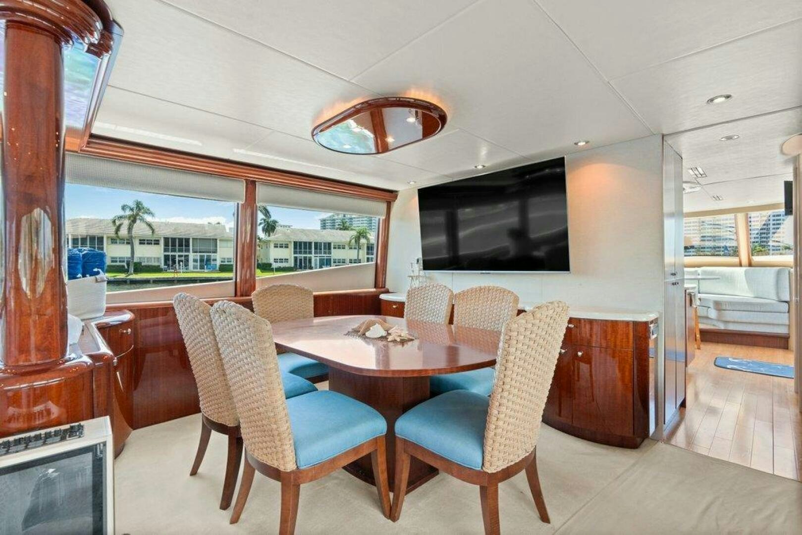 a dining room with a table and chairs aboard FOMO2 Yacht for Sale