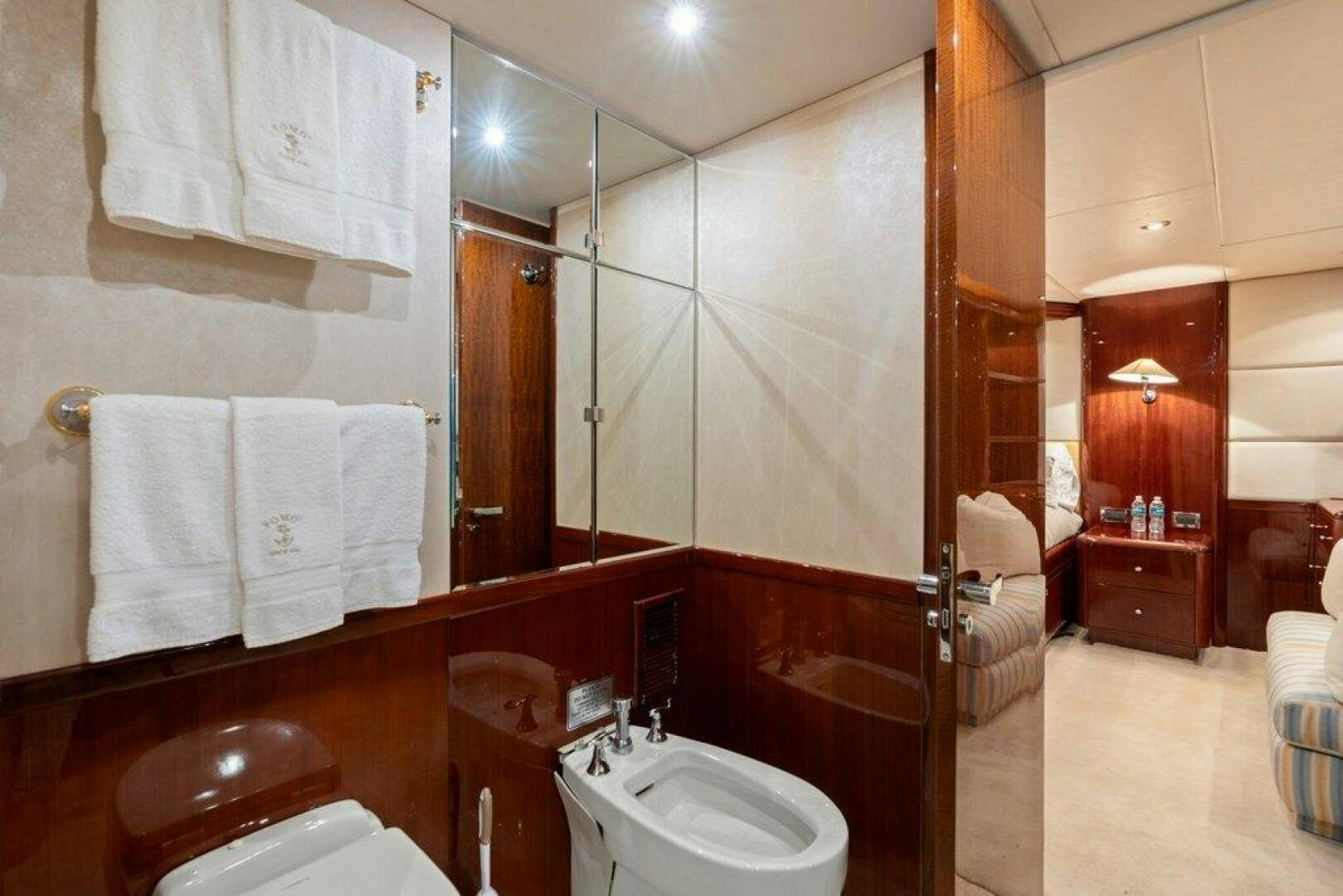 a bathroom with a large mirror aboard FOMO2 Yacht for Sale