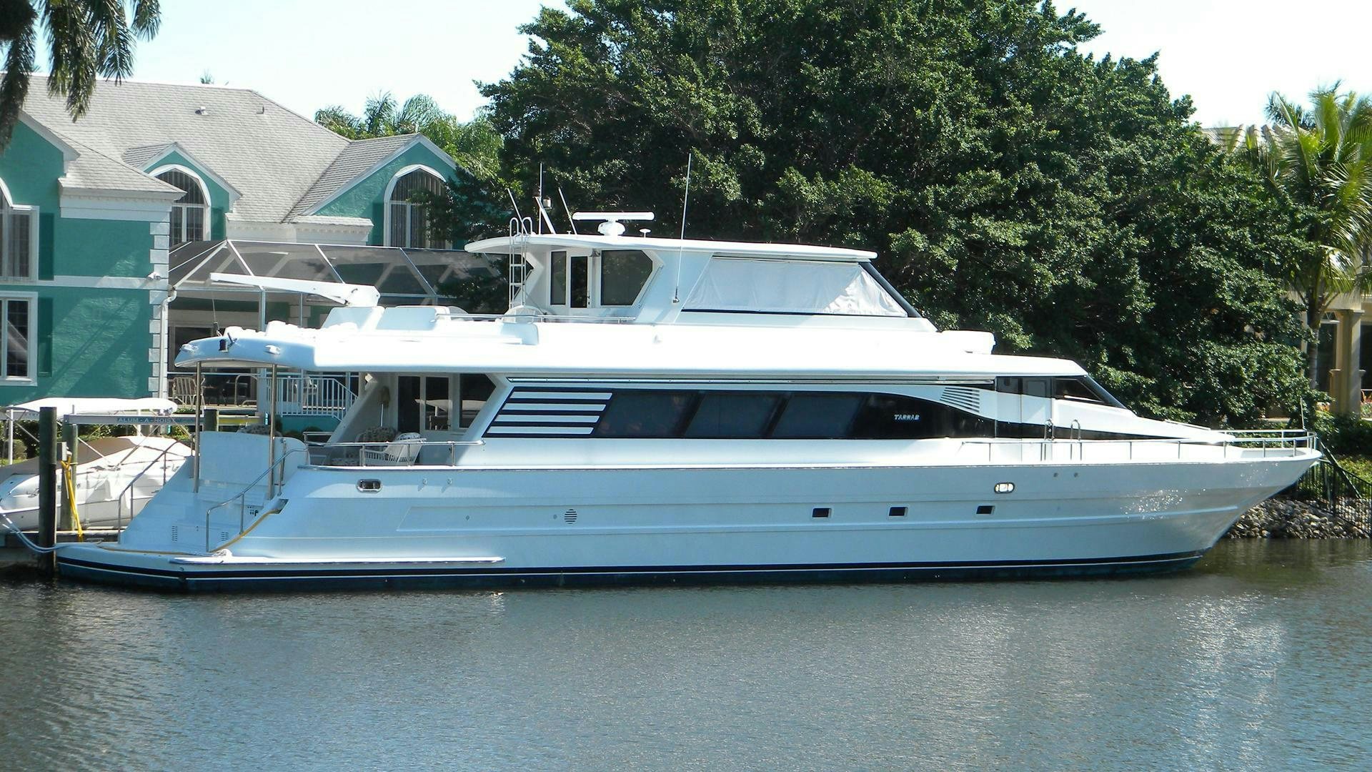 a white boat on a river aboard PAINKILLER Yacht for Sale