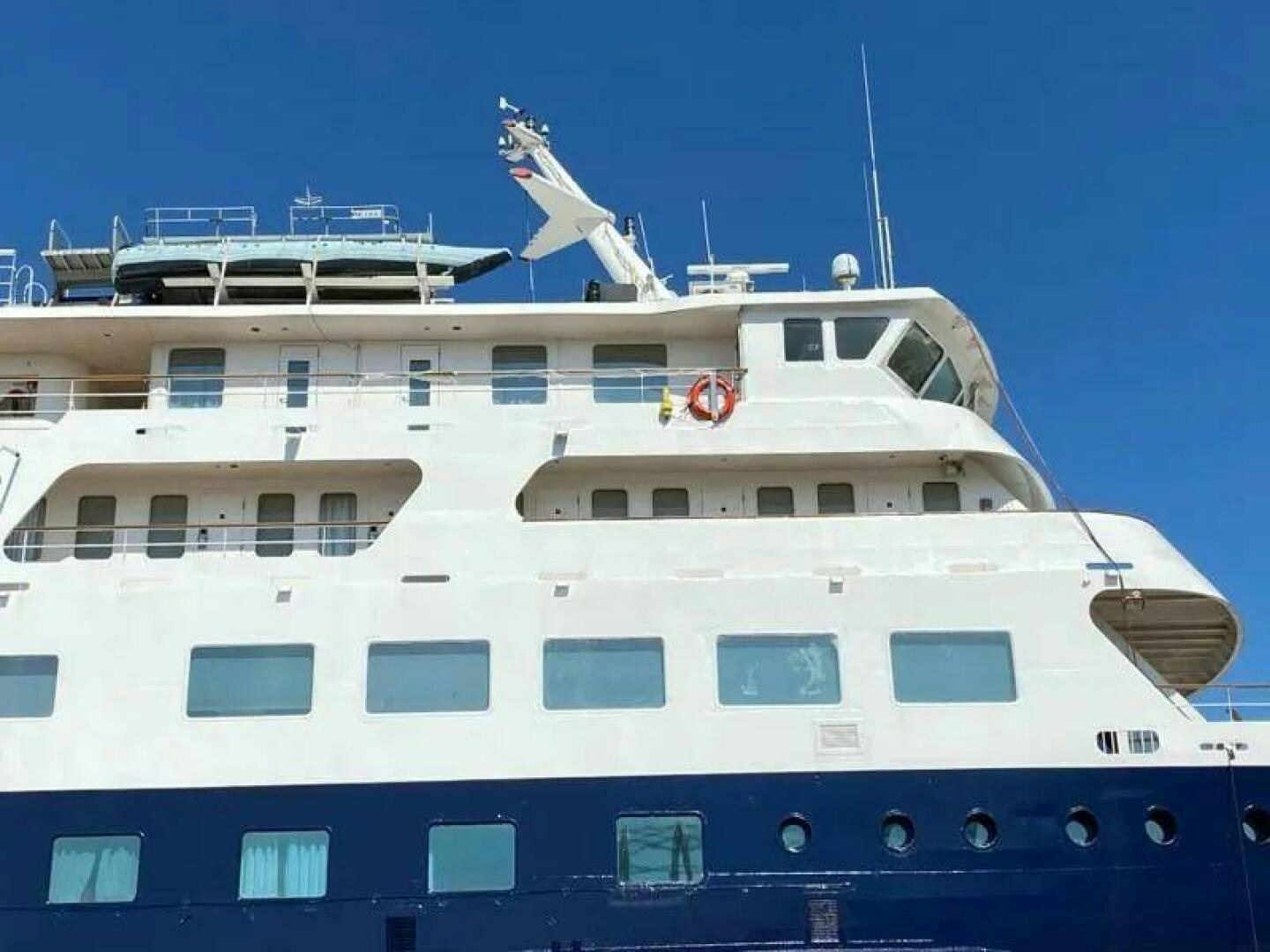 a large white cruise ship aboard AMERICANA Yacht for Sale