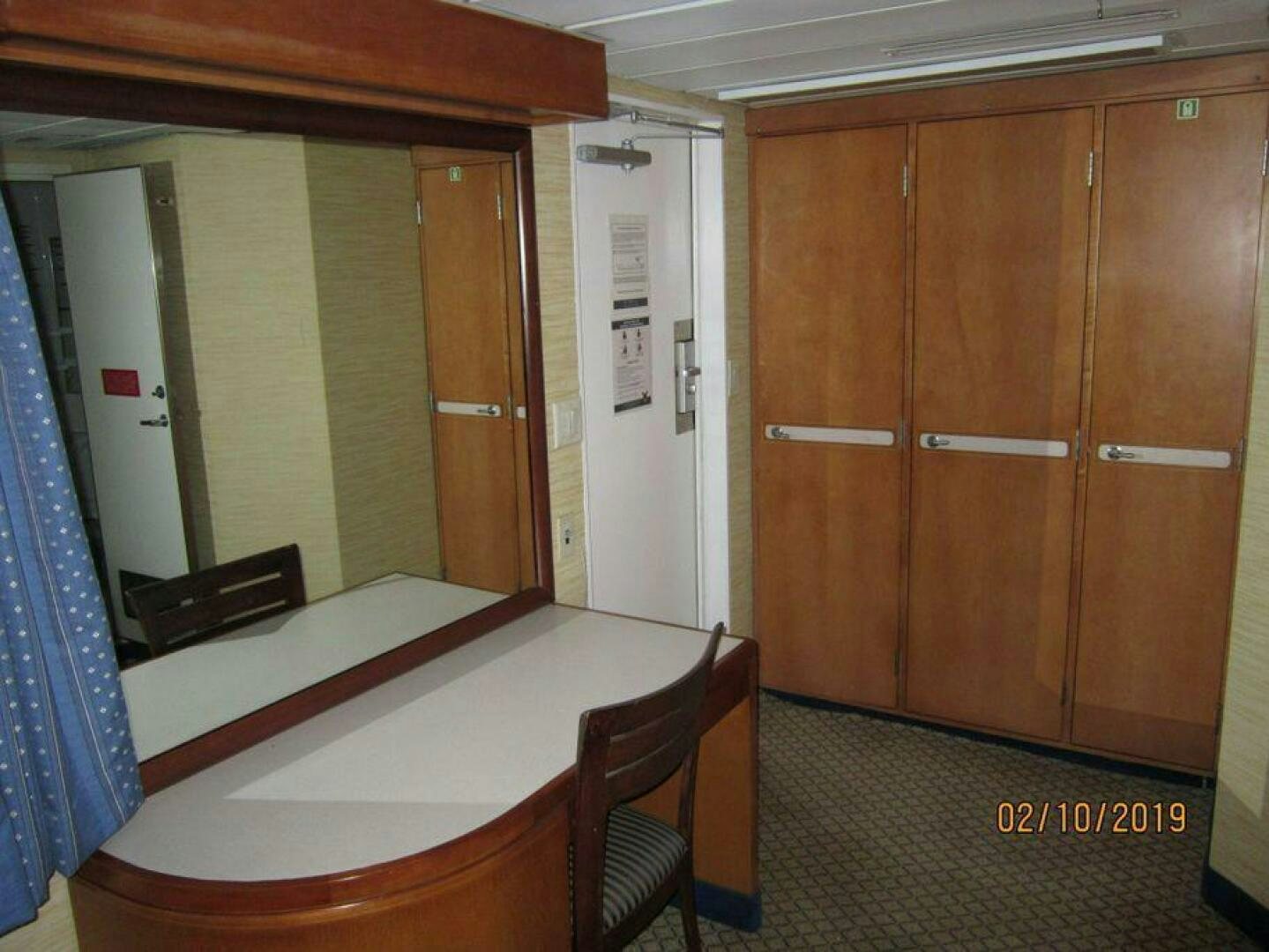 a room with a table and chairs aboard AMERICANA Yacht for Sale