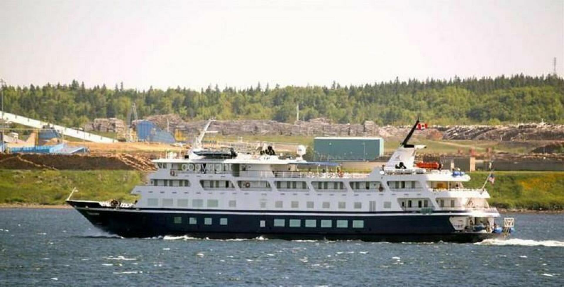a large white boat aboard AMERICANA Yacht for Sale