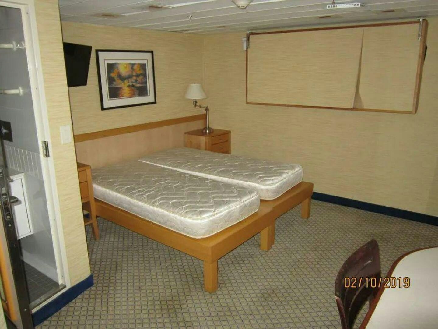 a bed in a room aboard AMERICANA Yacht for Sale