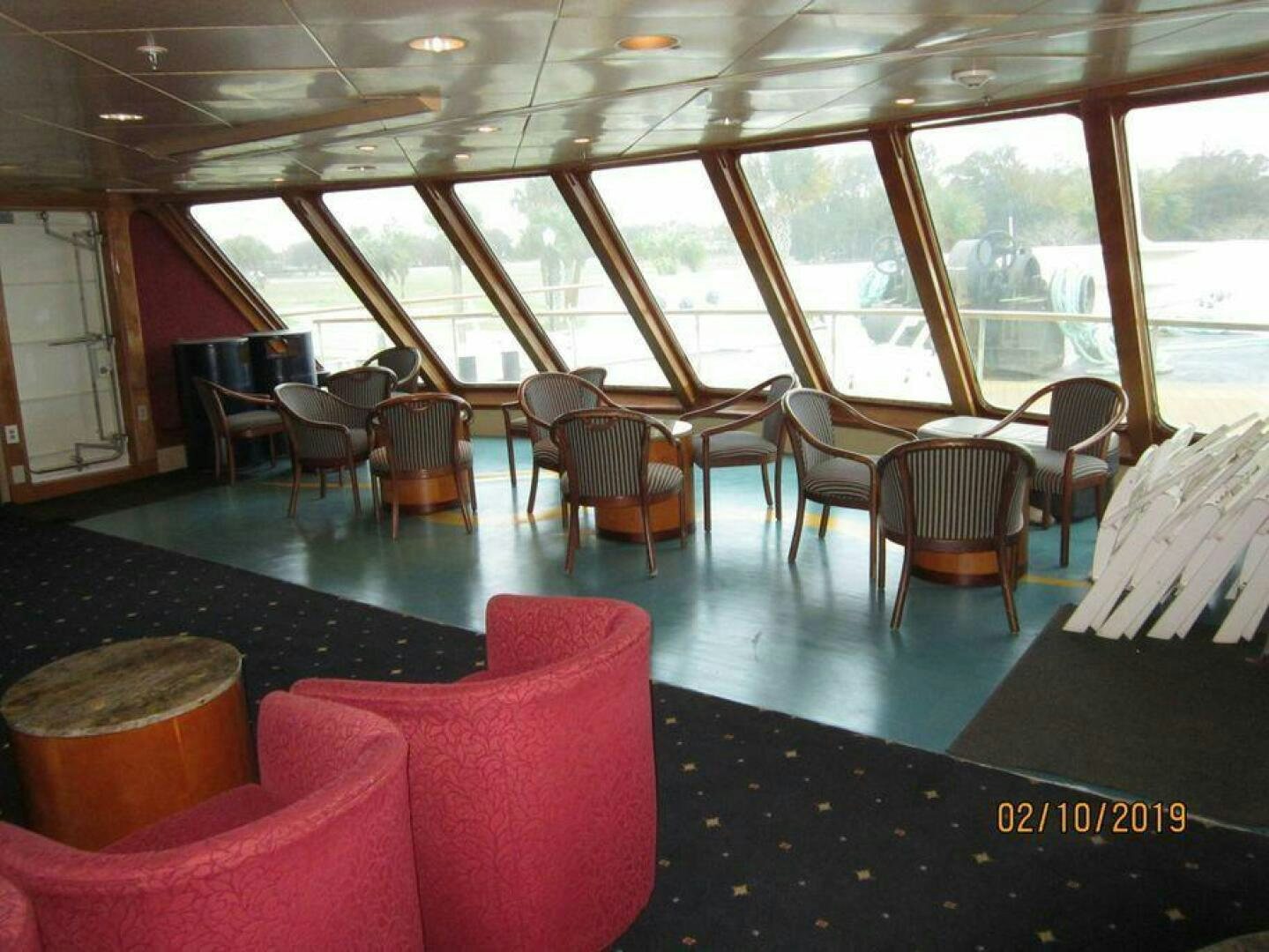 a room with a table and chairs aboard AMERICANA Yacht for Sale
