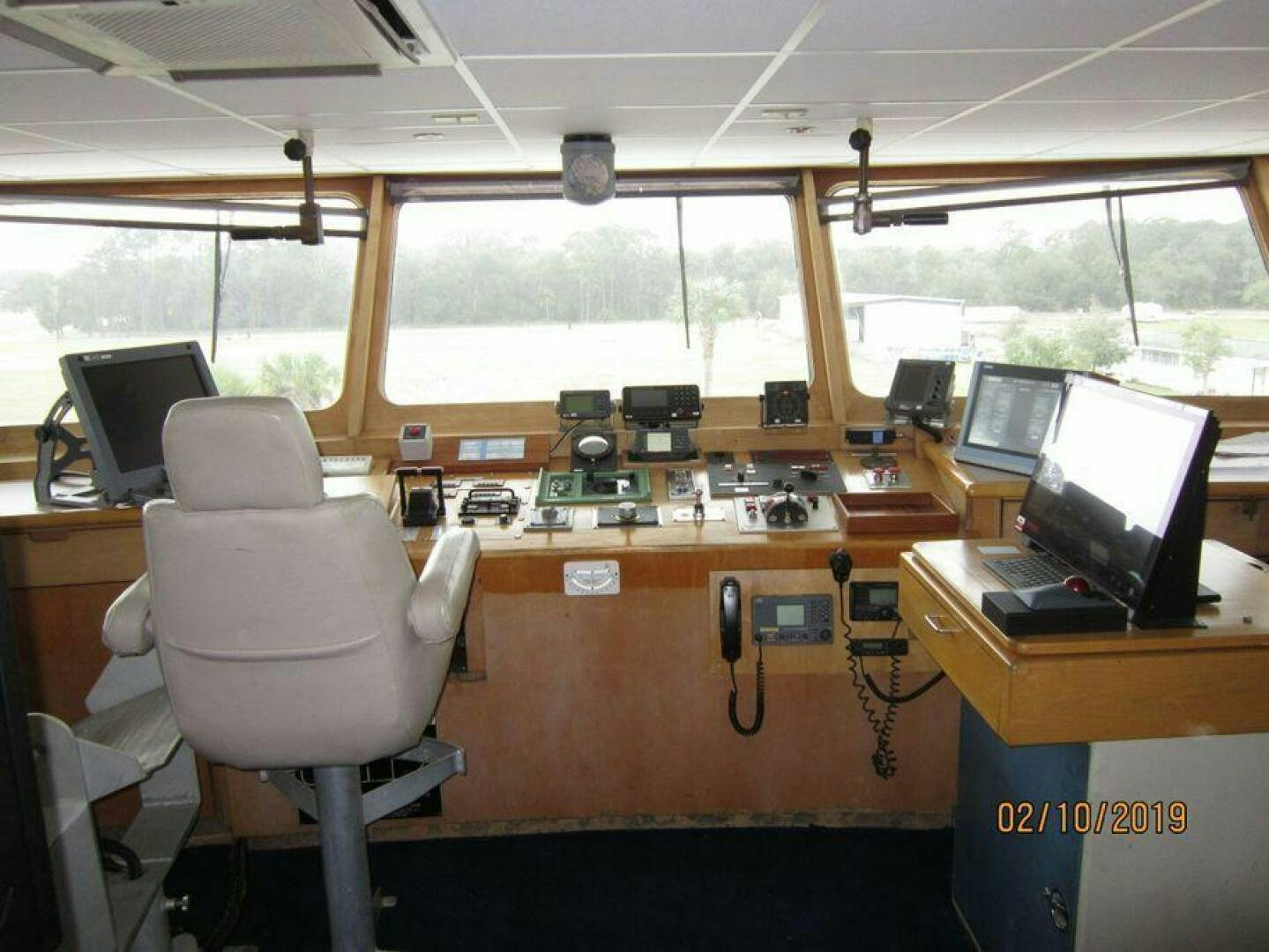 a room with computers and monitors aboard AMERICANA Yacht for Sale