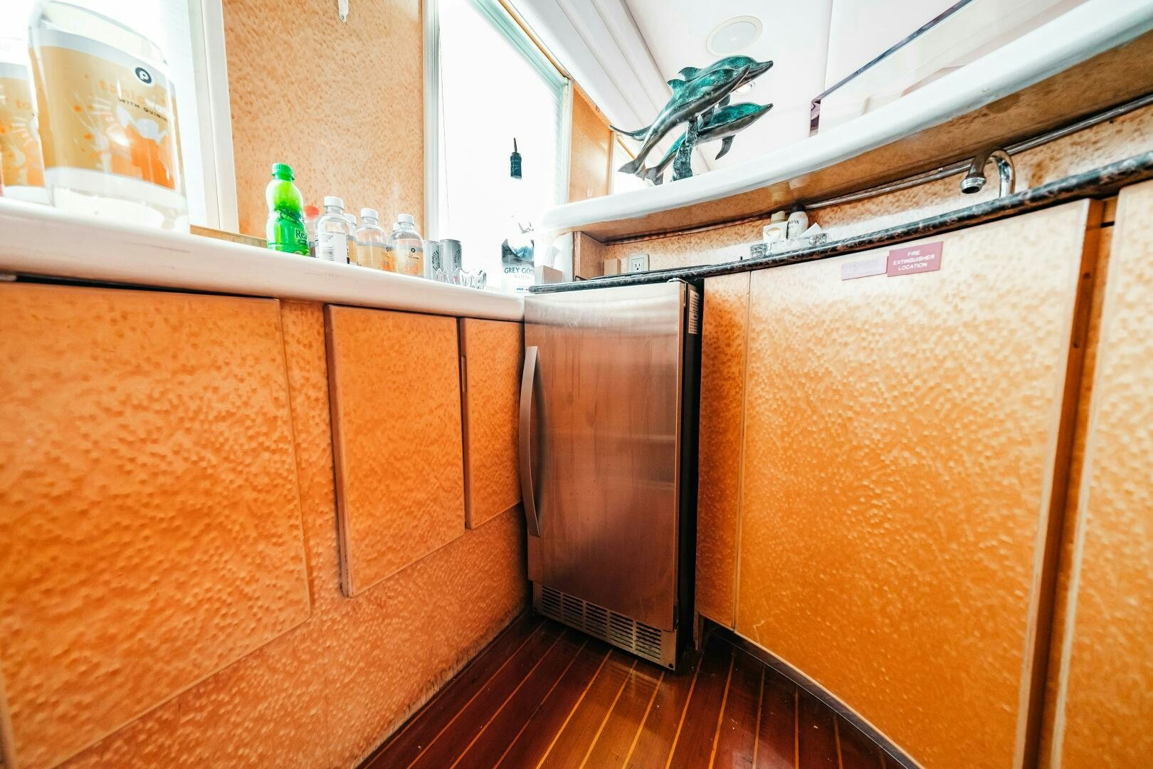 a kitchen with wooden cabinets aboard GLORIAS SUN Yacht for Sale