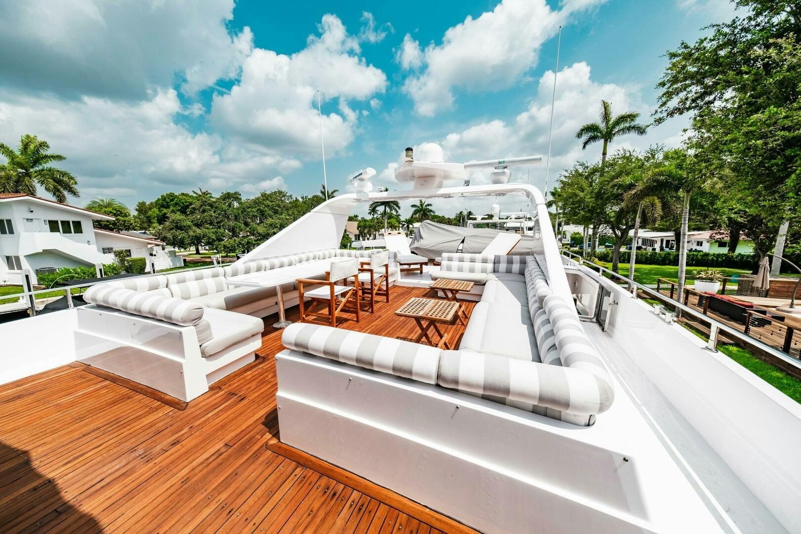 a deck with a large white boat on it aboard GLORIAS SUN Yacht for Sale