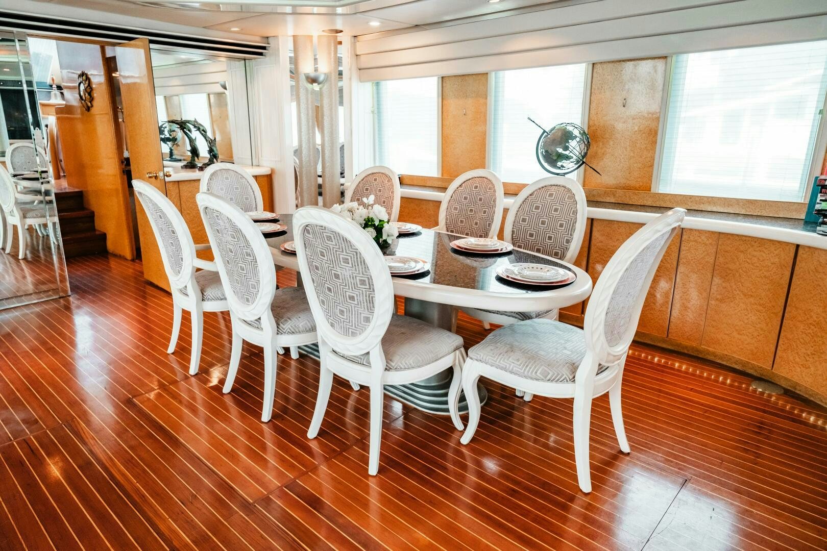 a dining room with chairs aboard GLORIAS SUN Yacht for Sale