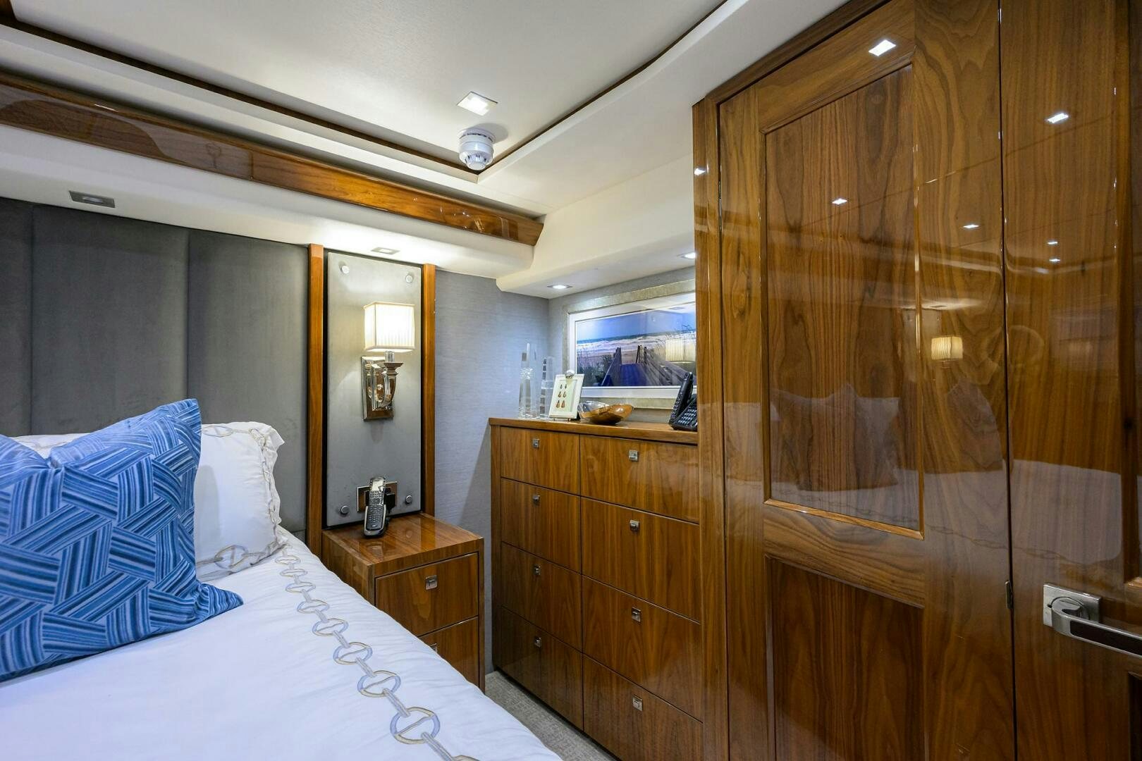 a bedroom with a bed and a closet aboard BACCHUS Yacht for Sale