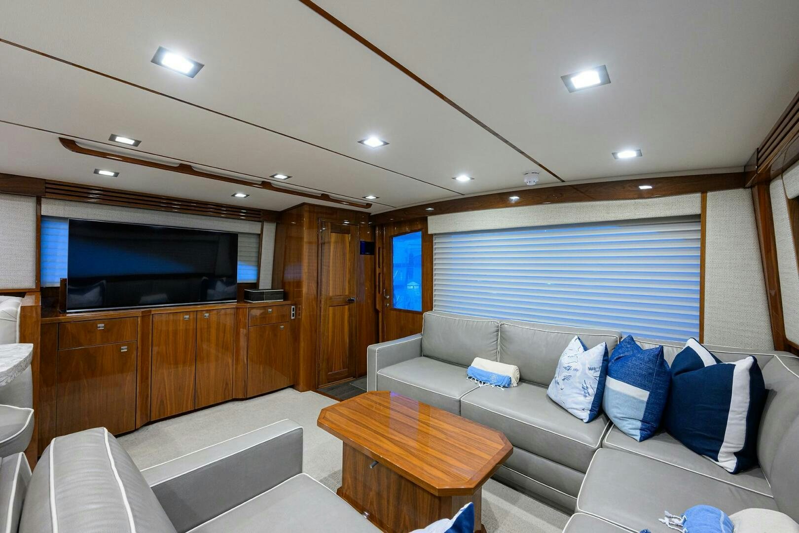 a living room with a couch and a tv aboard BACCHUS Yacht for Sale