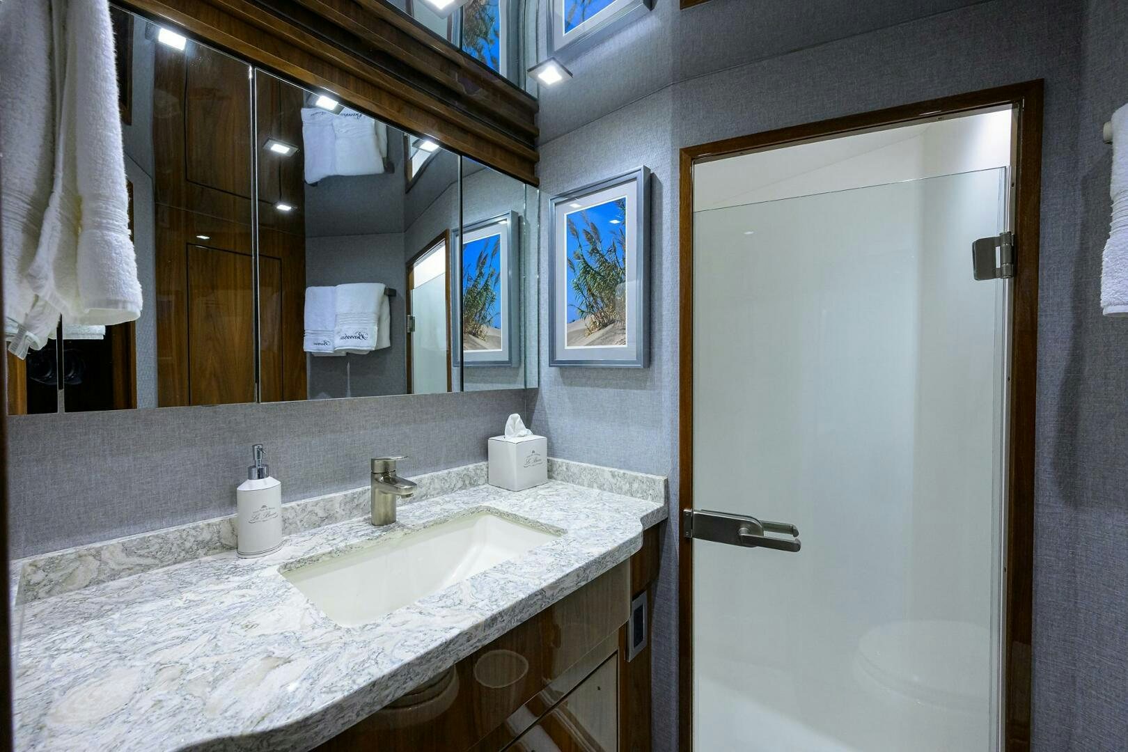 a bathroom with a large mirror aboard BACCHUS Yacht for Sale
