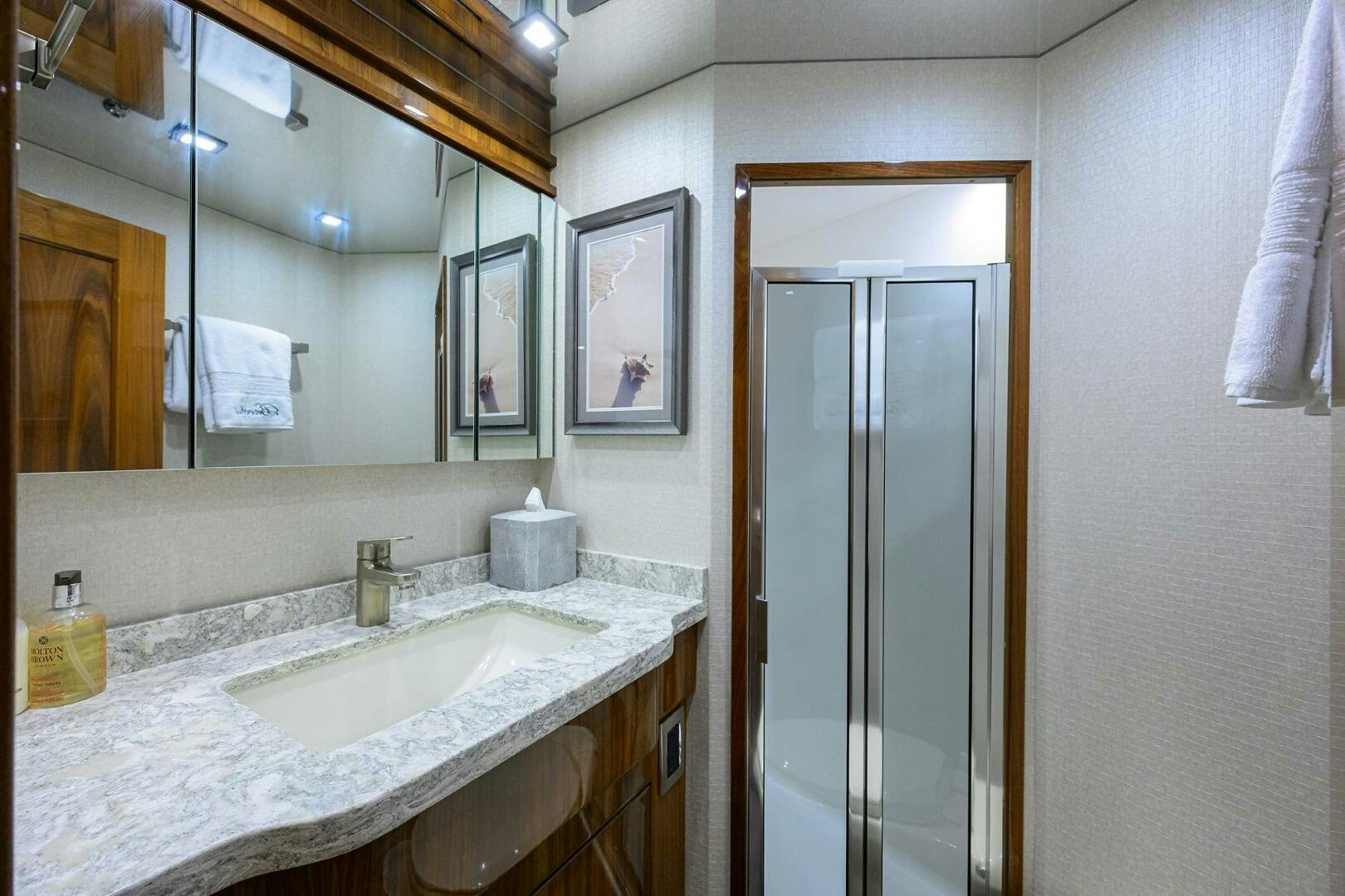 a bathroom with a sink and a mirror aboard BACCHUS Yacht for Sale