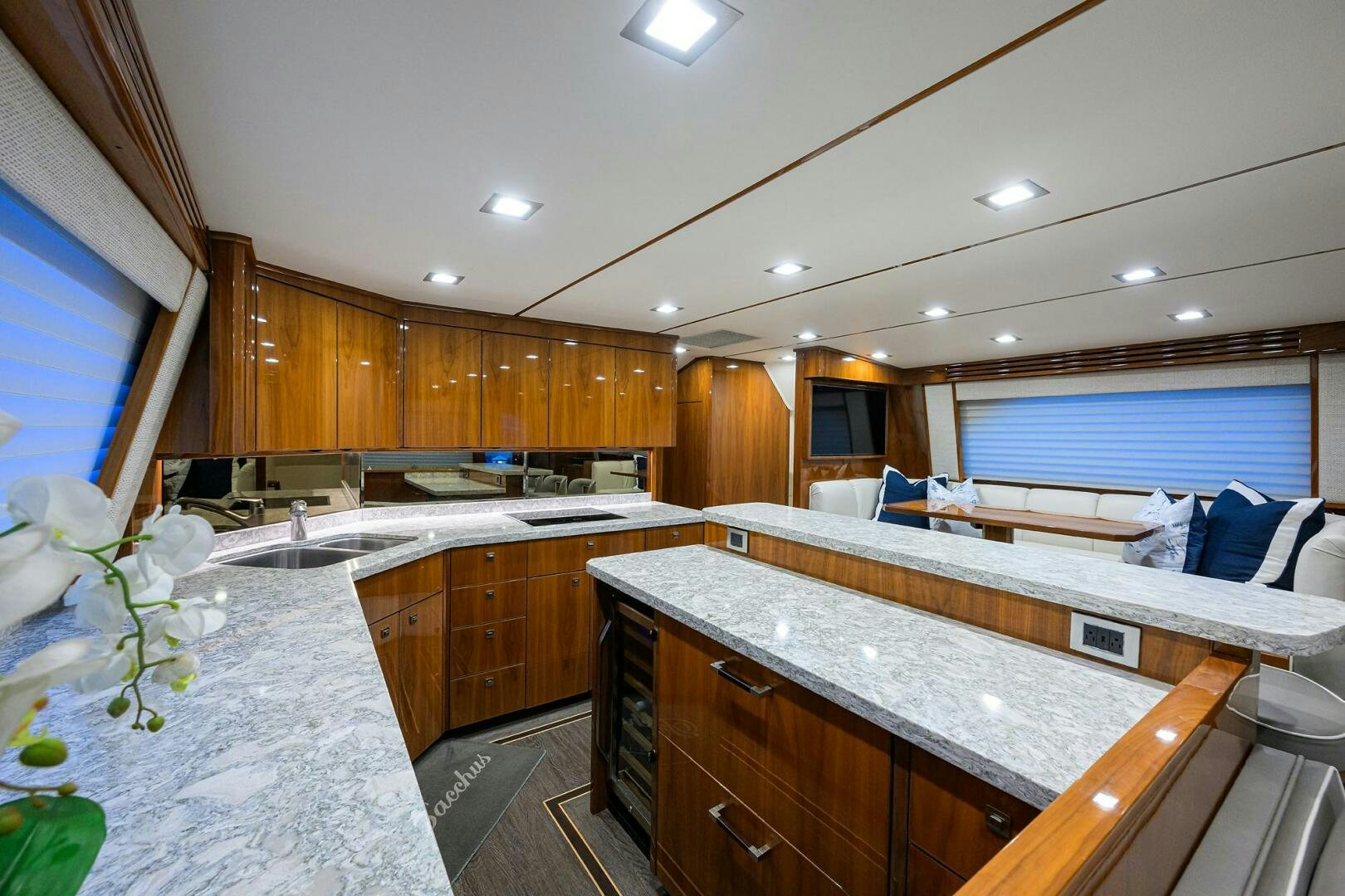 a large kitchen with wooden cabinets aboard BACCHUS Yacht for Sale