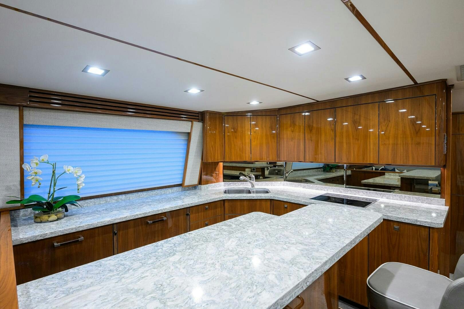 a kitchen with wooden cabinets aboard BACCHUS Yacht for Sale