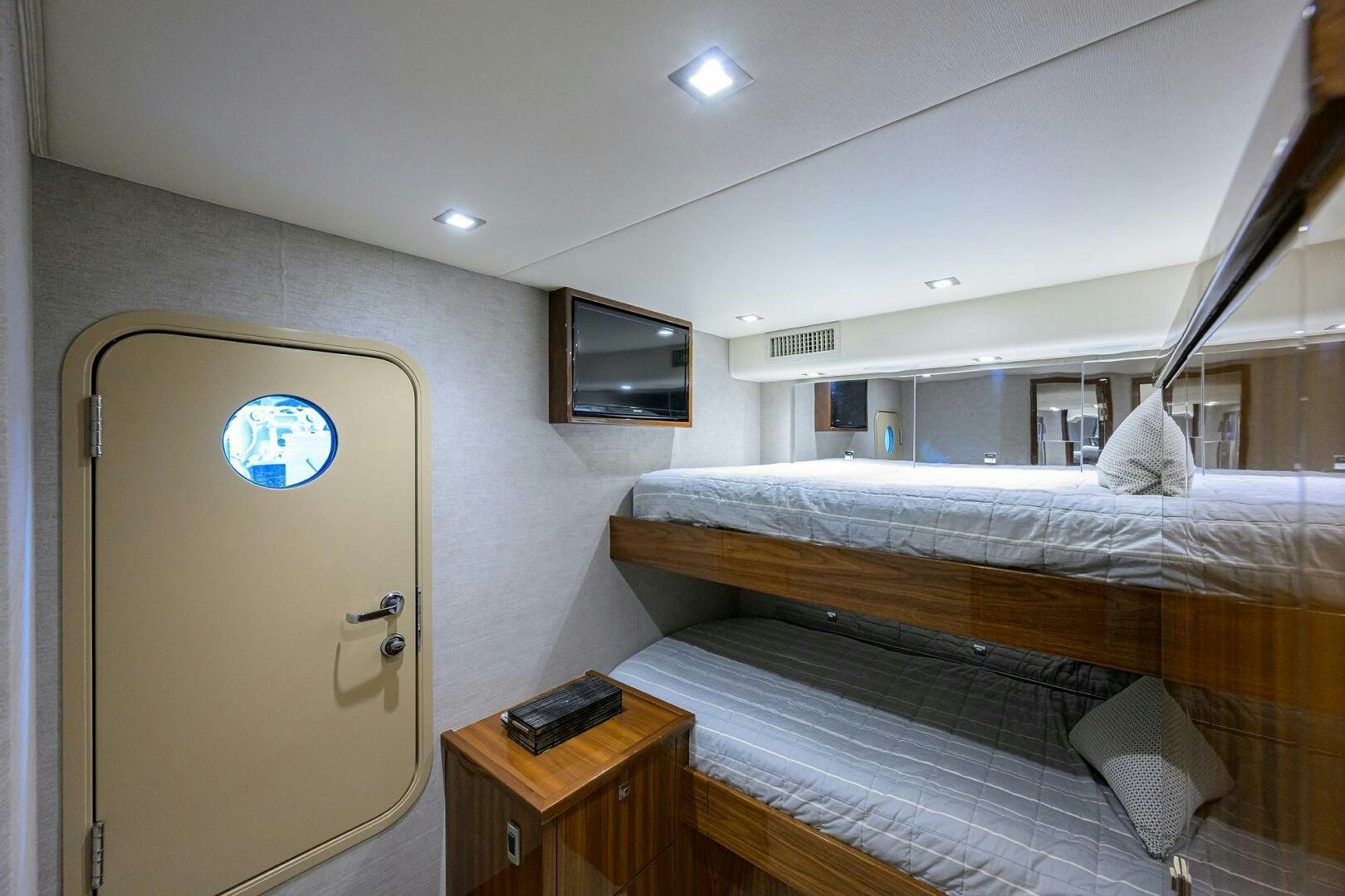 a room with a bed and a television aboard BACCHUS Yacht for Sale