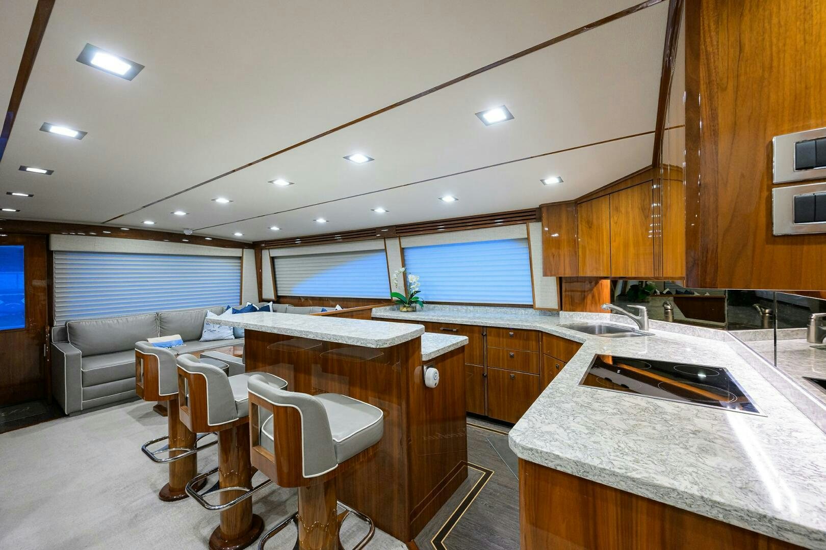a kitchen with a bar and a table aboard BACCHUS Yacht for Sale