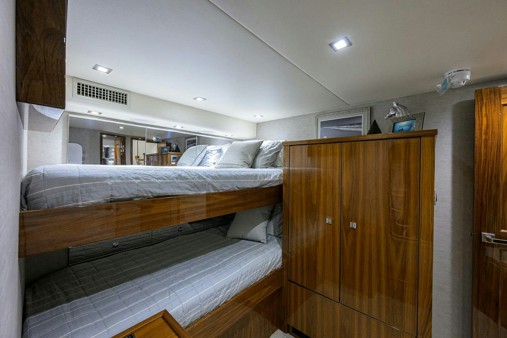 a bedroom with a bed and a closet aboard BACCHUS Yacht for Sale