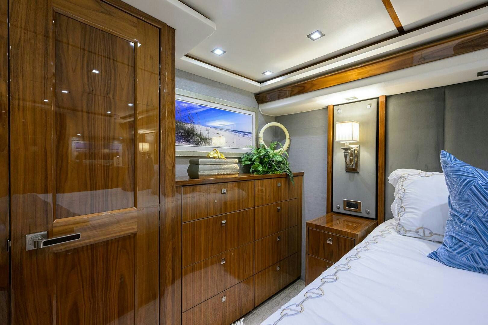 a bedroom with a wood cabinet aboard BACCHUS Yacht for Sale
