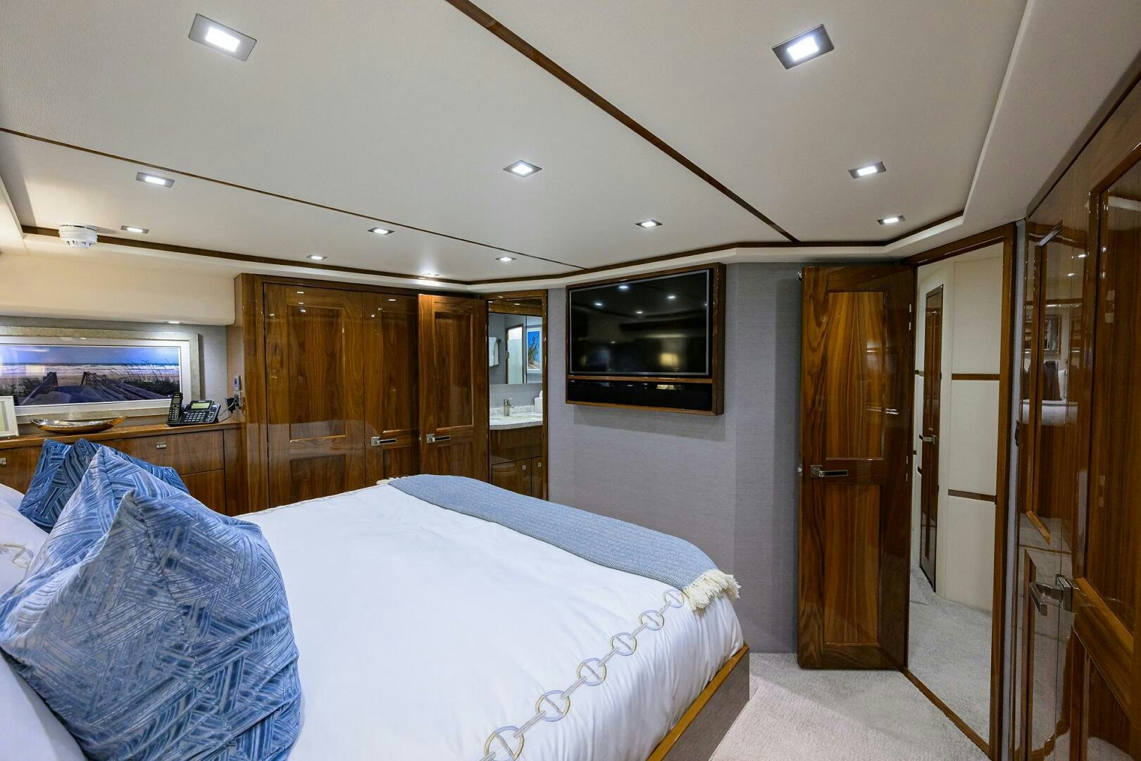 a hotel room with a bed and tv aboard BACCHUS Yacht for Sale