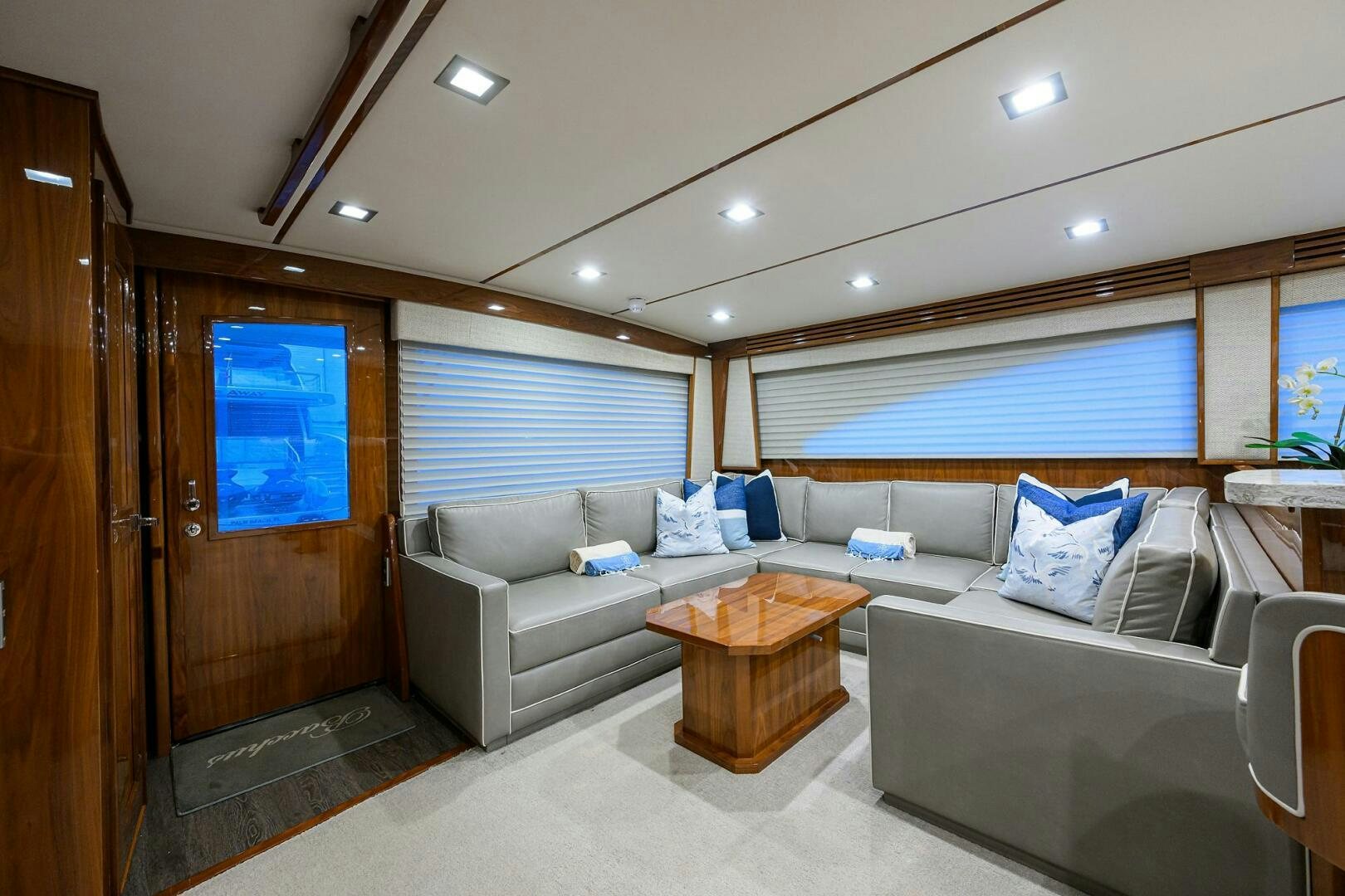 a living room with a couch and a table aboard BACCHUS Yacht for Sale