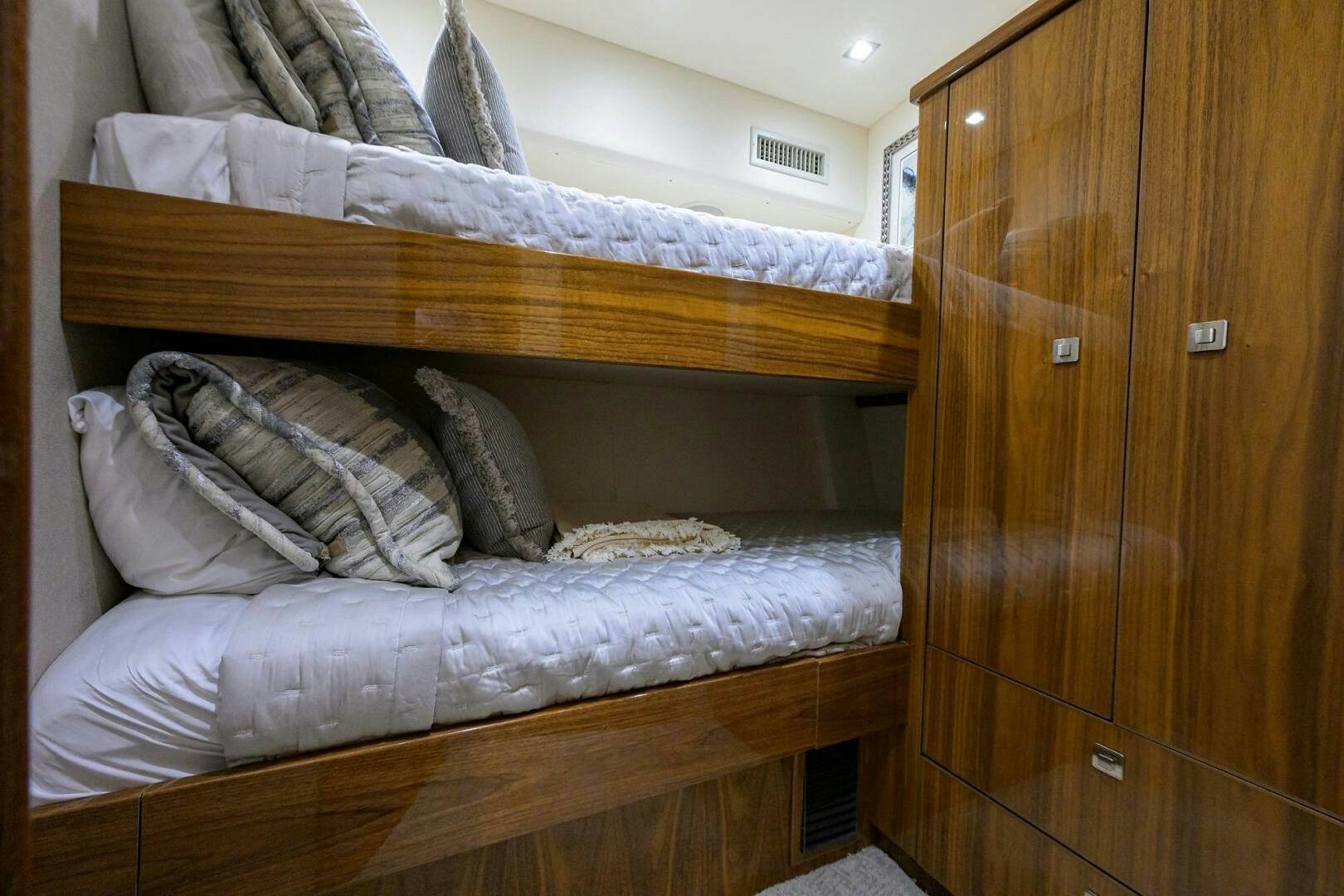 a bed with pillows aboard BACCHUS Yacht for Sale